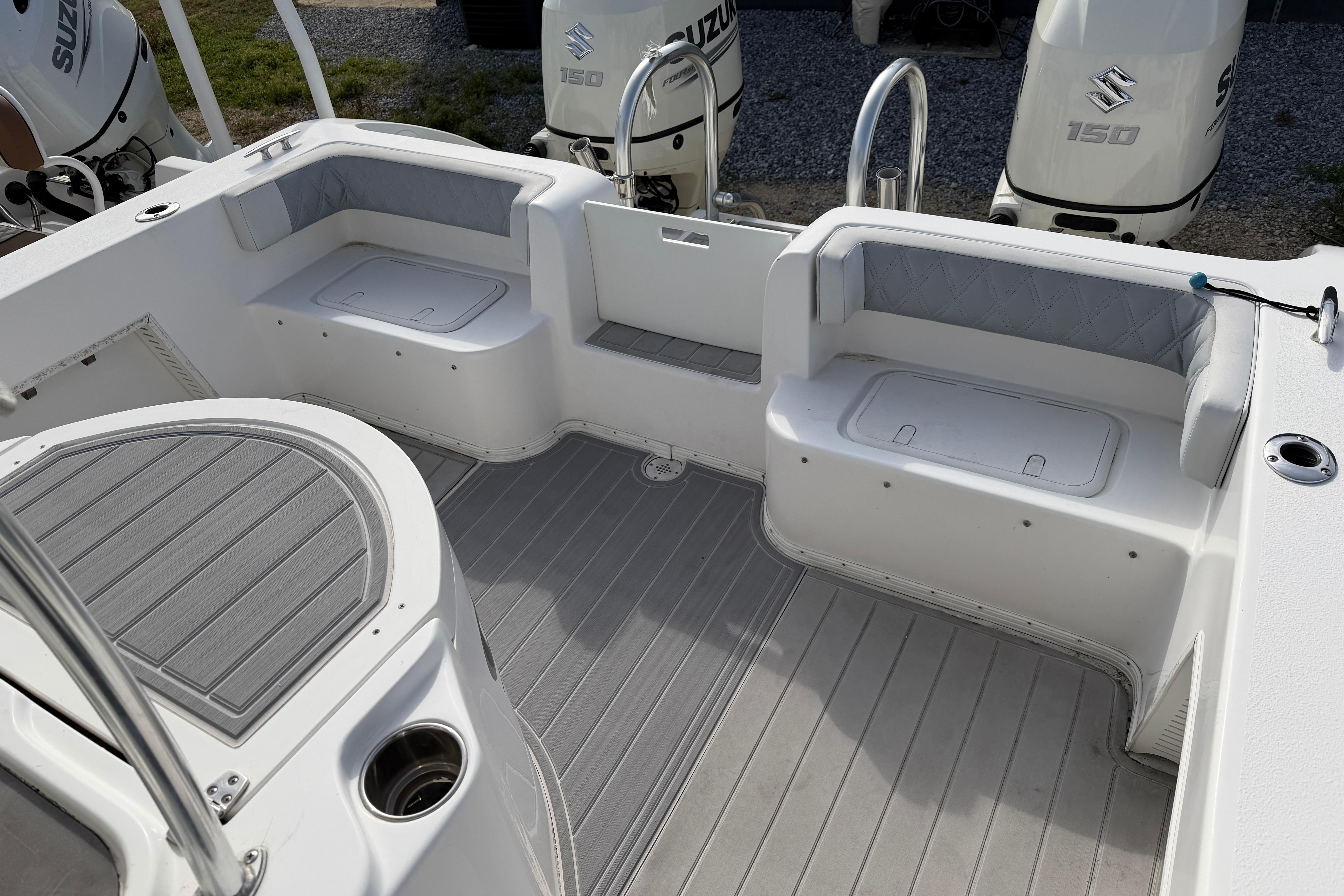 2018 Twin Vee 260 CC SE boat interior with seating and Suzuki 150 engines.