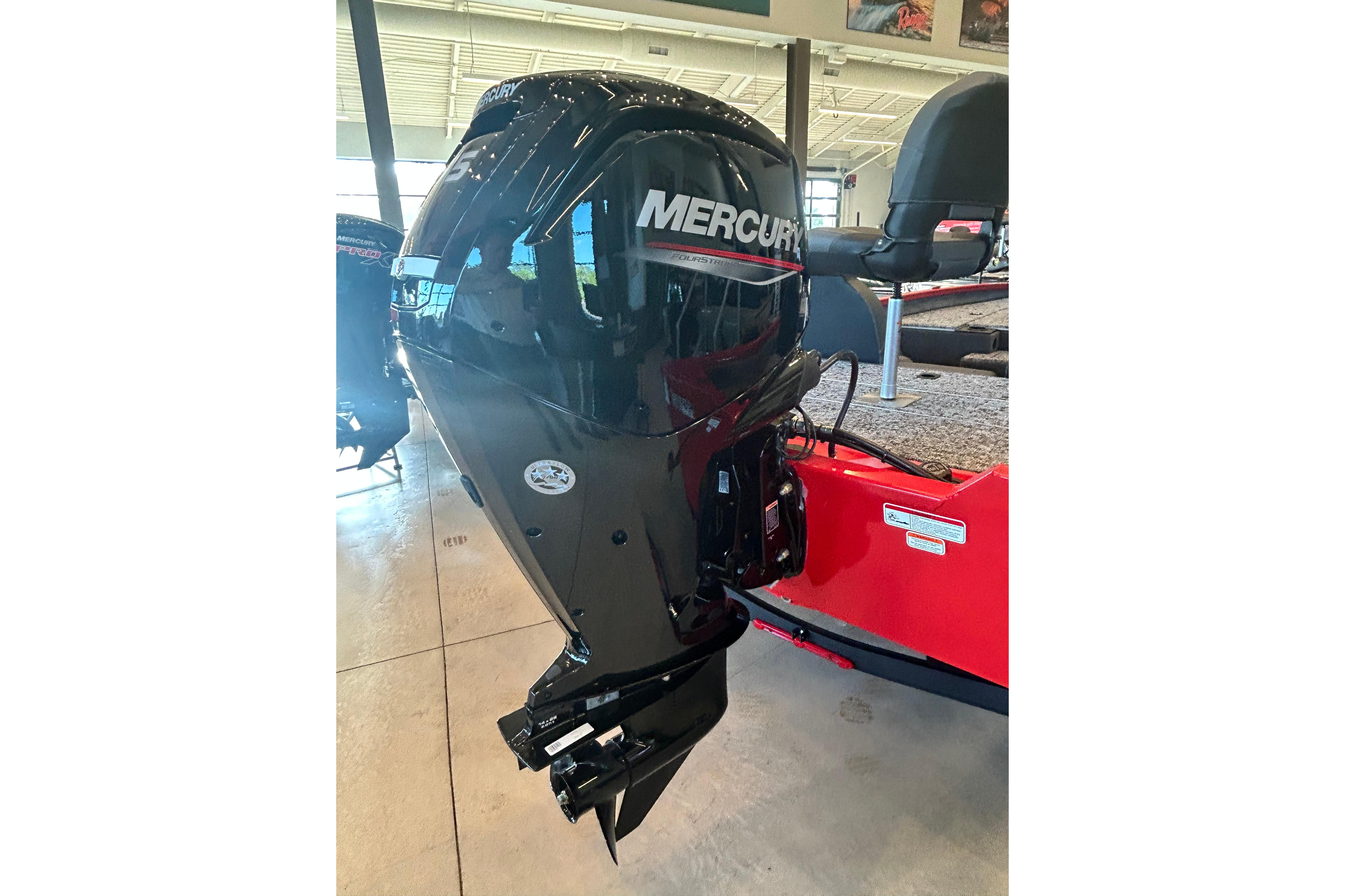 2026 Tracker Pro Team 175 with Mercury outboard motor in showroom.
