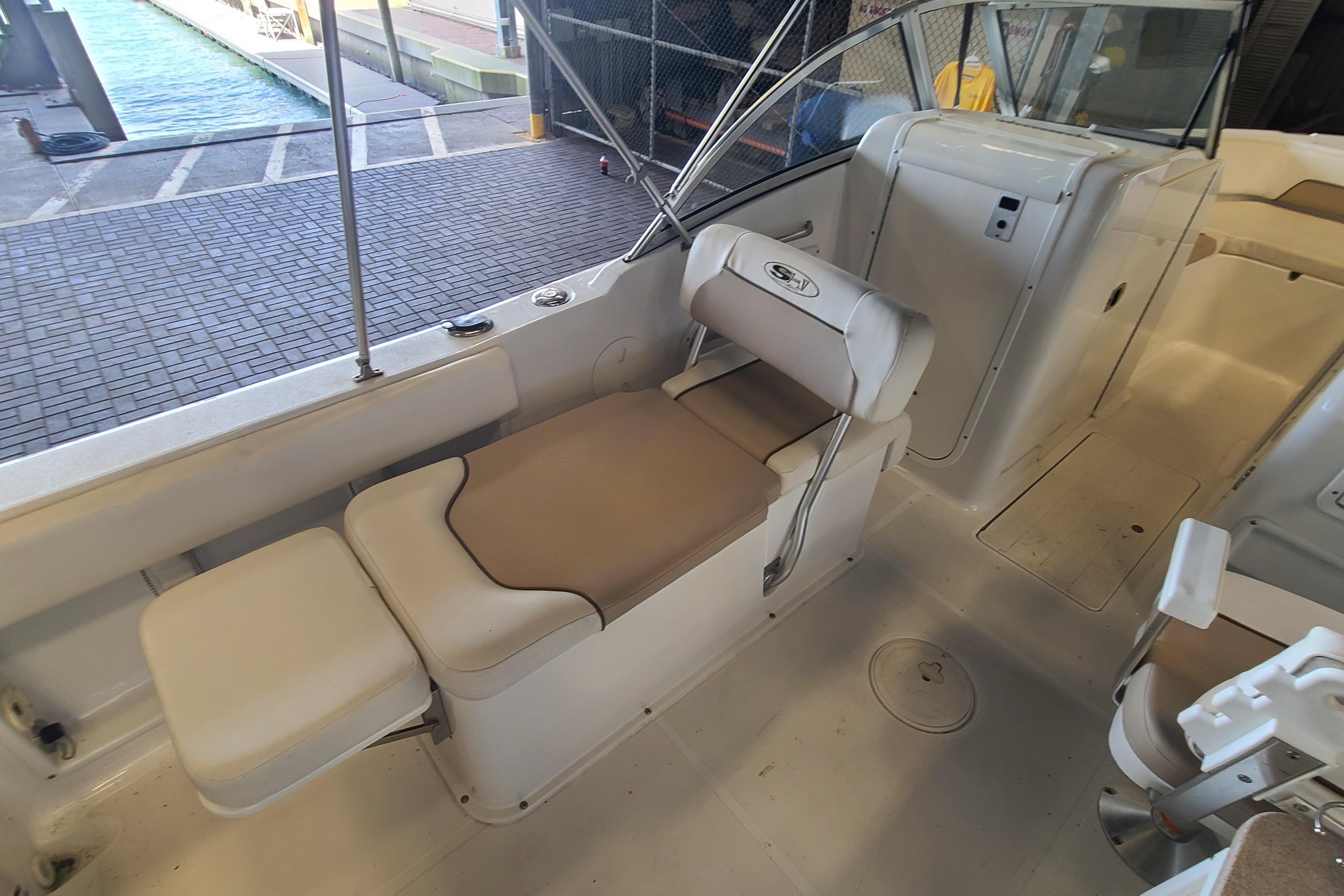 2013 Sea Hunt Escape 234 LE boat interior with seating and helm area.