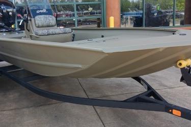 2026 Tracker Grizzly 1860 CC boat on trailer, parked outdoors.