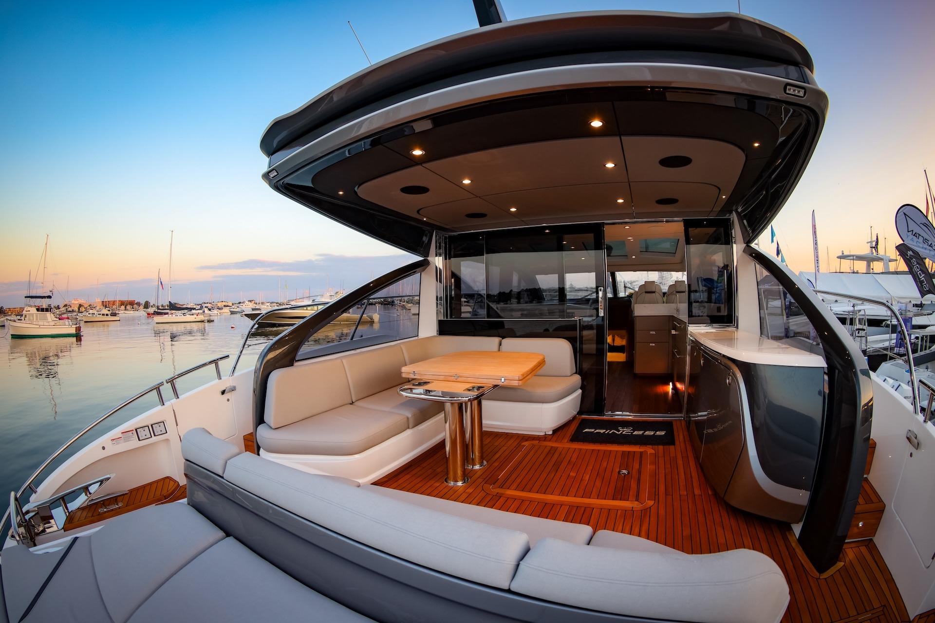 Luxurious Princess V55 Express yacht 2026 in harbor at sunset.