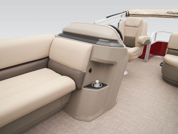 2024 Sun Tracker PARTY BARGE® 18 DLX interior with beige seating and helm.