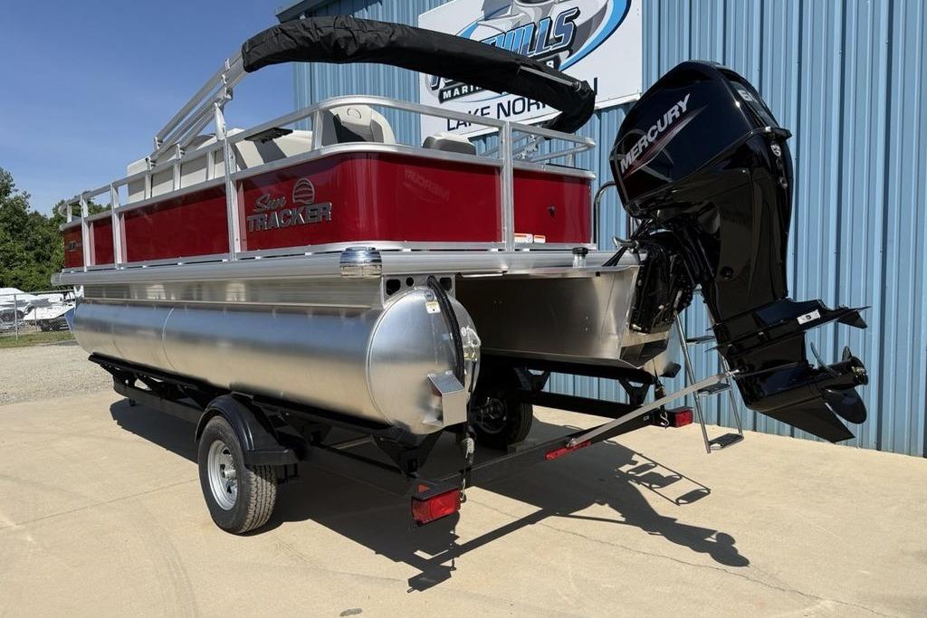 2026 Sun Tracker Bass Buggy 18 DLX pontoon boat with Mercury outboard motor on trailer.