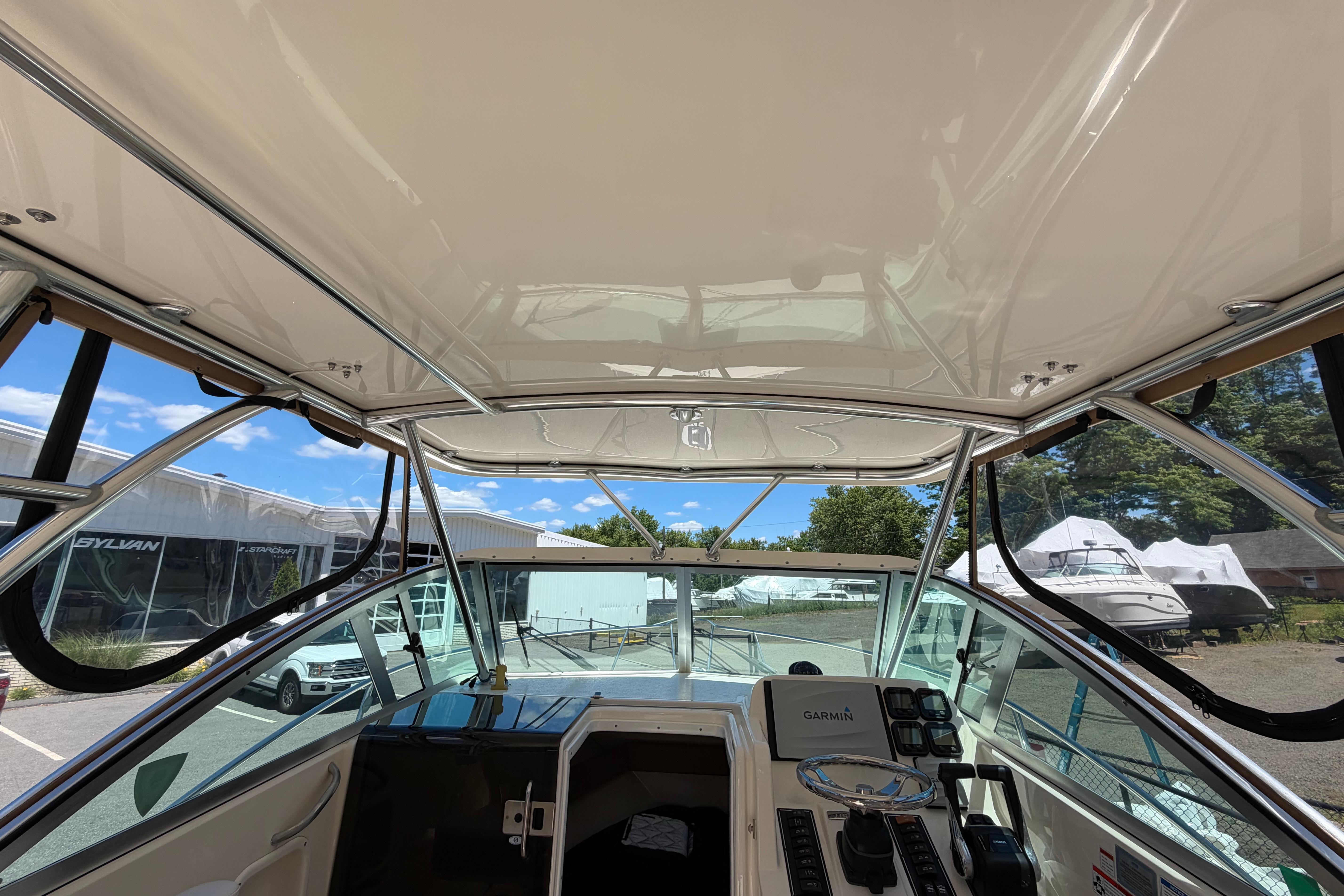 2010 Pursuit OS 255 Offshore boat interior with helm and navigation equipment.