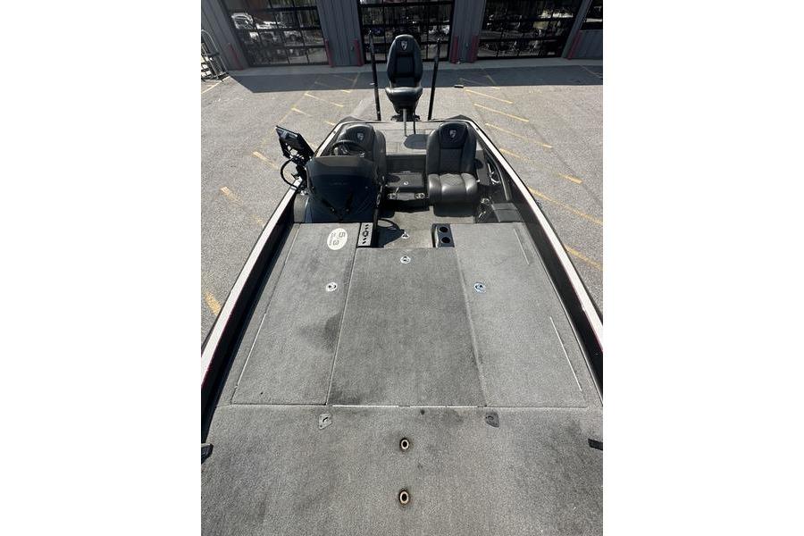 2016 Triton 20 TrX boat interior with seating and control panel, parked outdoors.