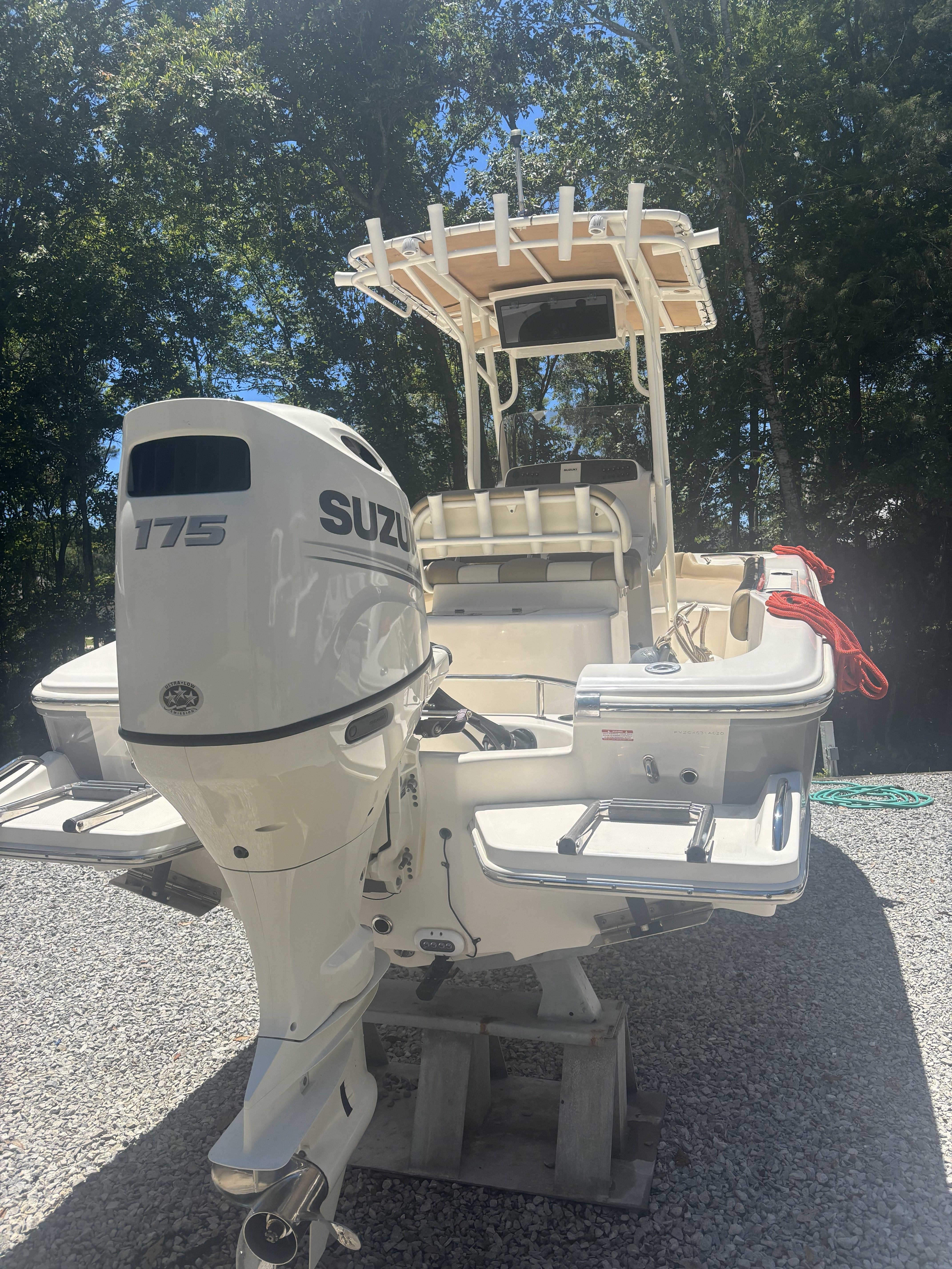 2020 Pioneer 202 Sportfish boat with Suzuki 175 engine outdoors.