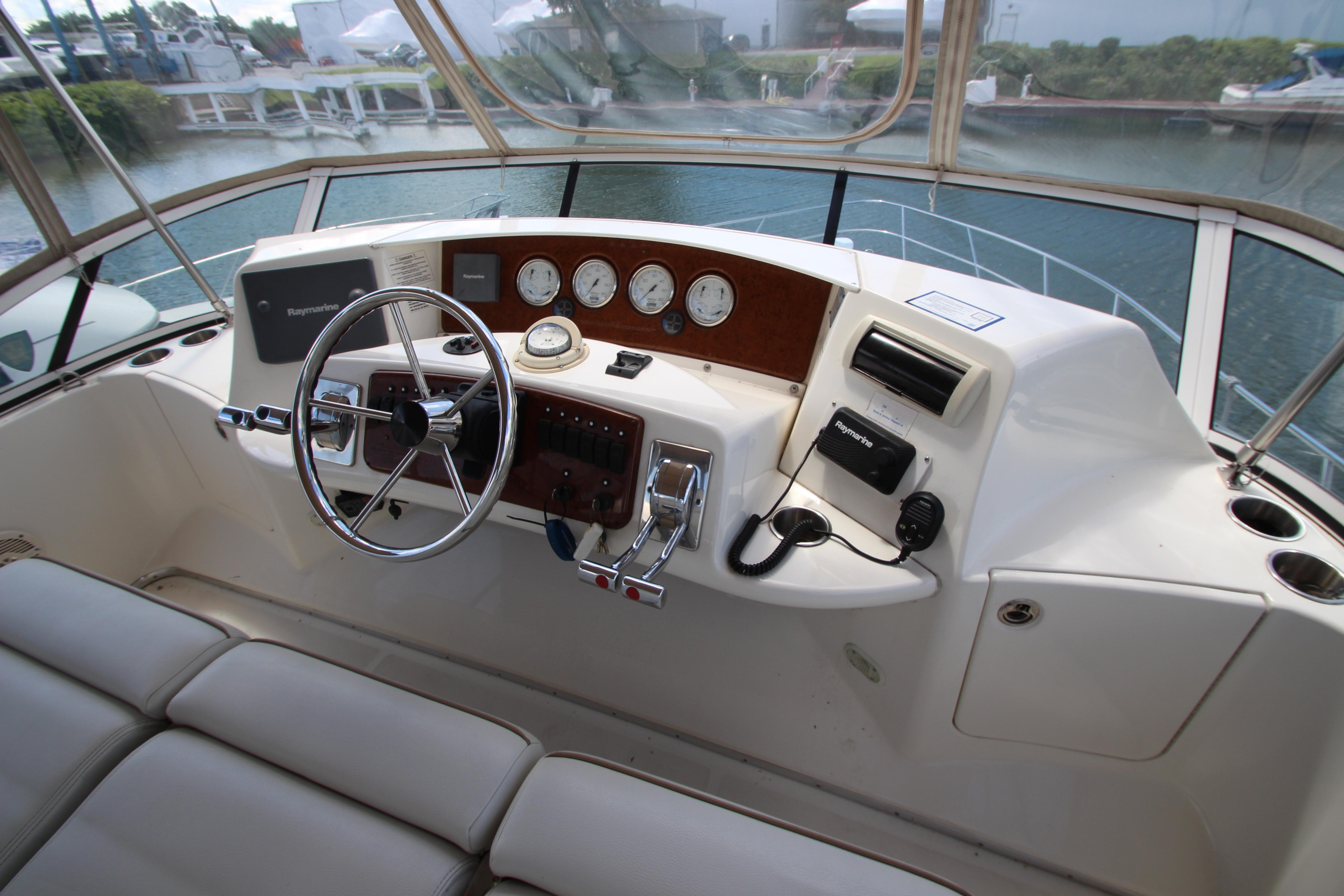 Helm of 2006 Silverton 38 Sport Bridge with steering wheel and navigation instruments.