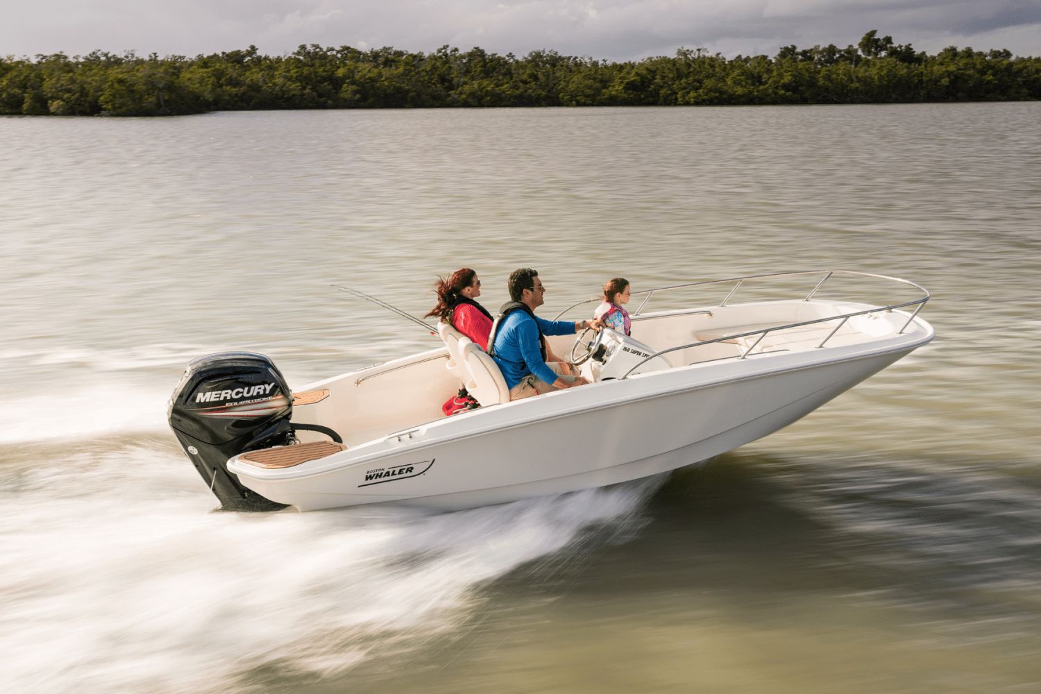 A family rides a Boston Whaler 160 Super Sport on calm waters.
