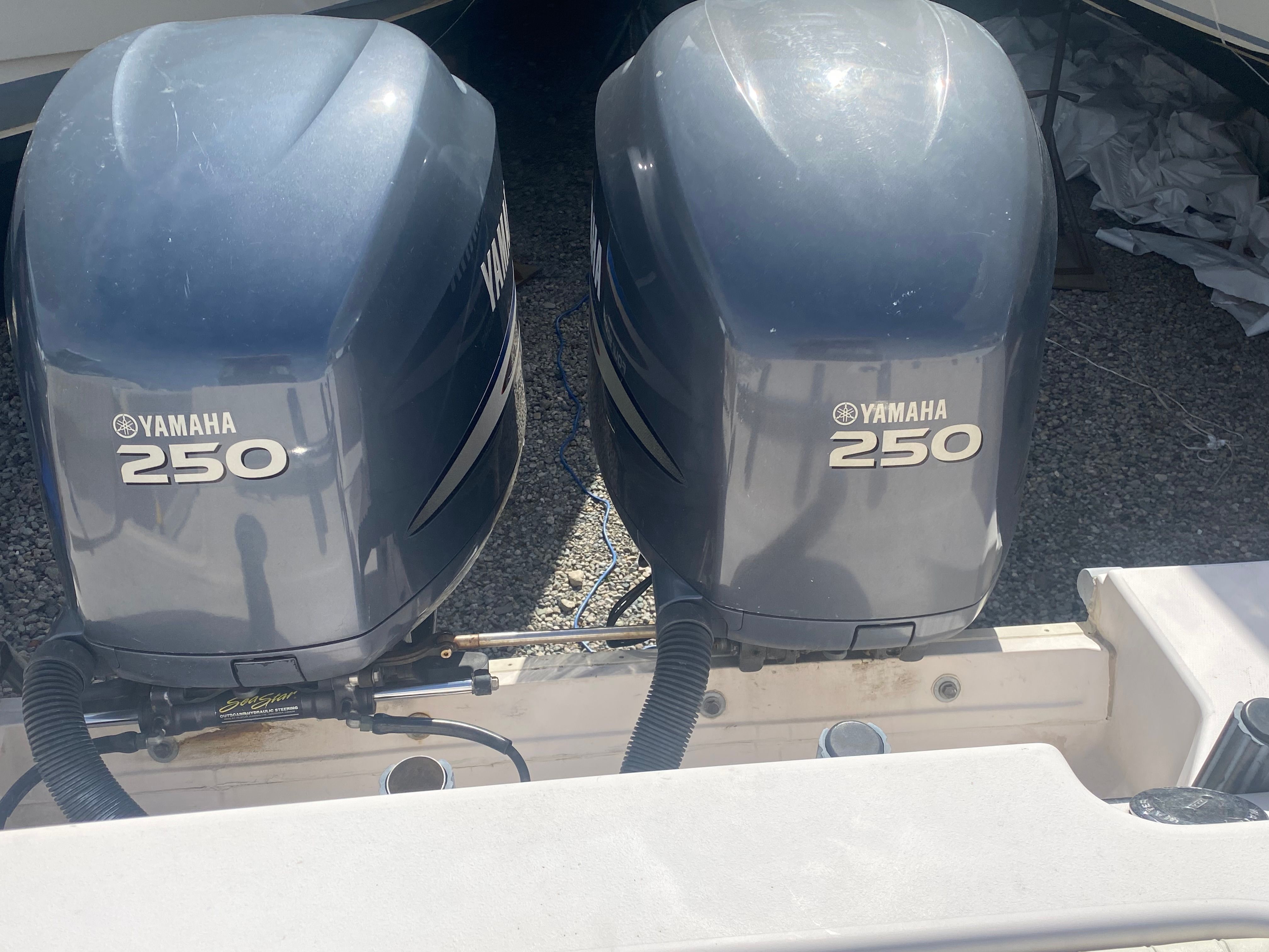Two Yamaha 250 outboard engines are mounted on the stern of a boat.
