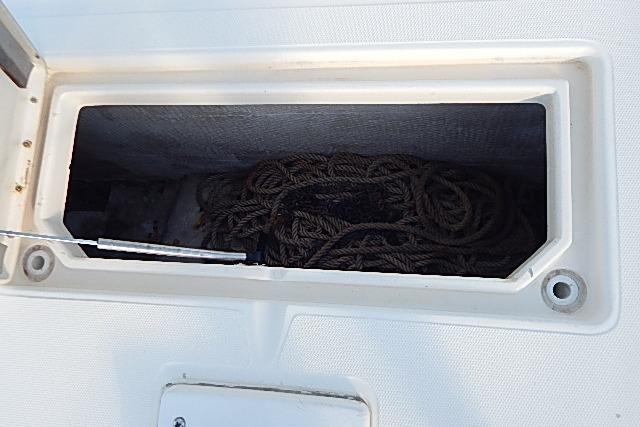 Storage compartment with rope on a 2003 World Cat 270 EC boat.
