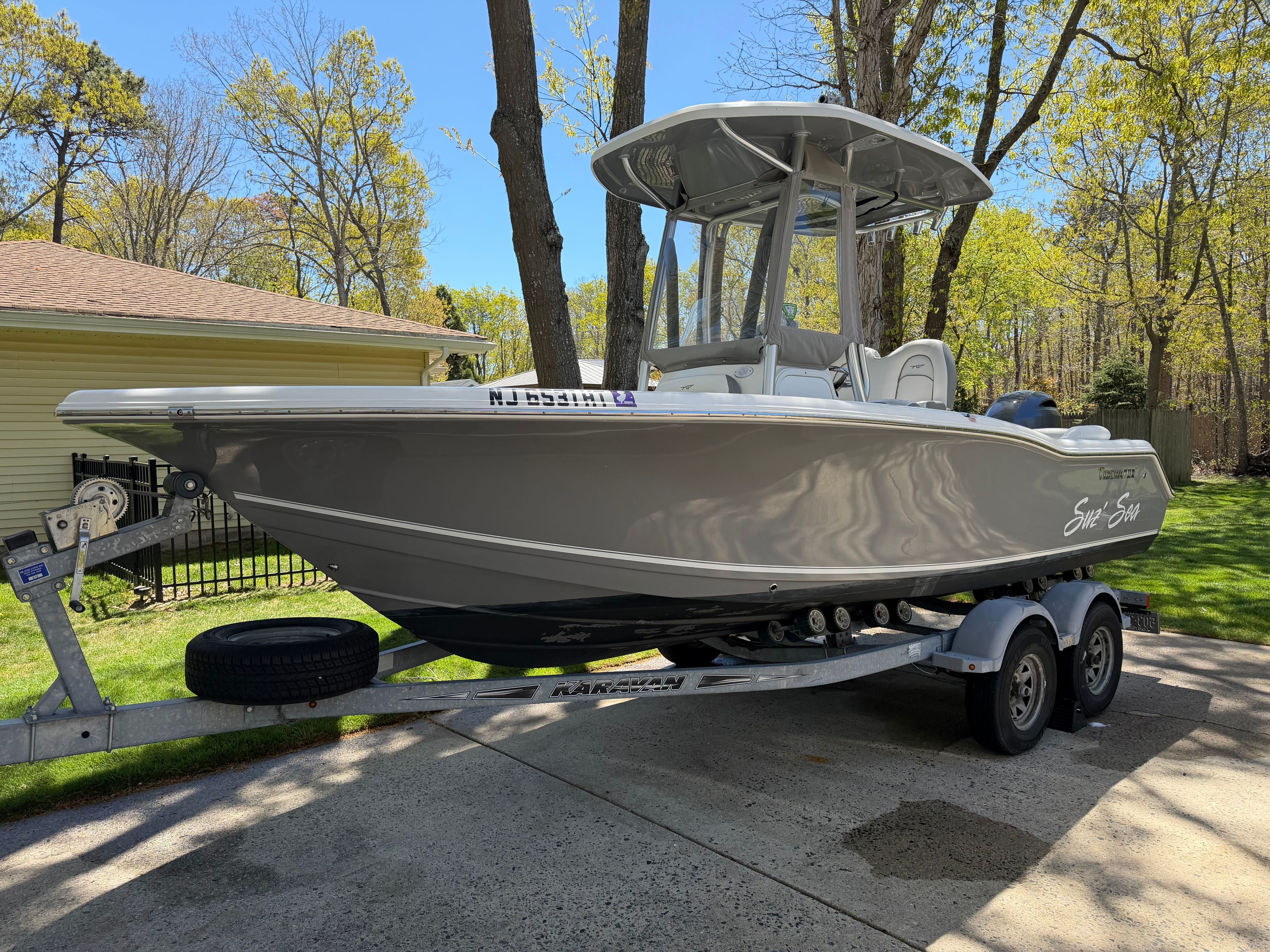 2016 Tidewater 210 LXF boat parked on trailer outdoors.