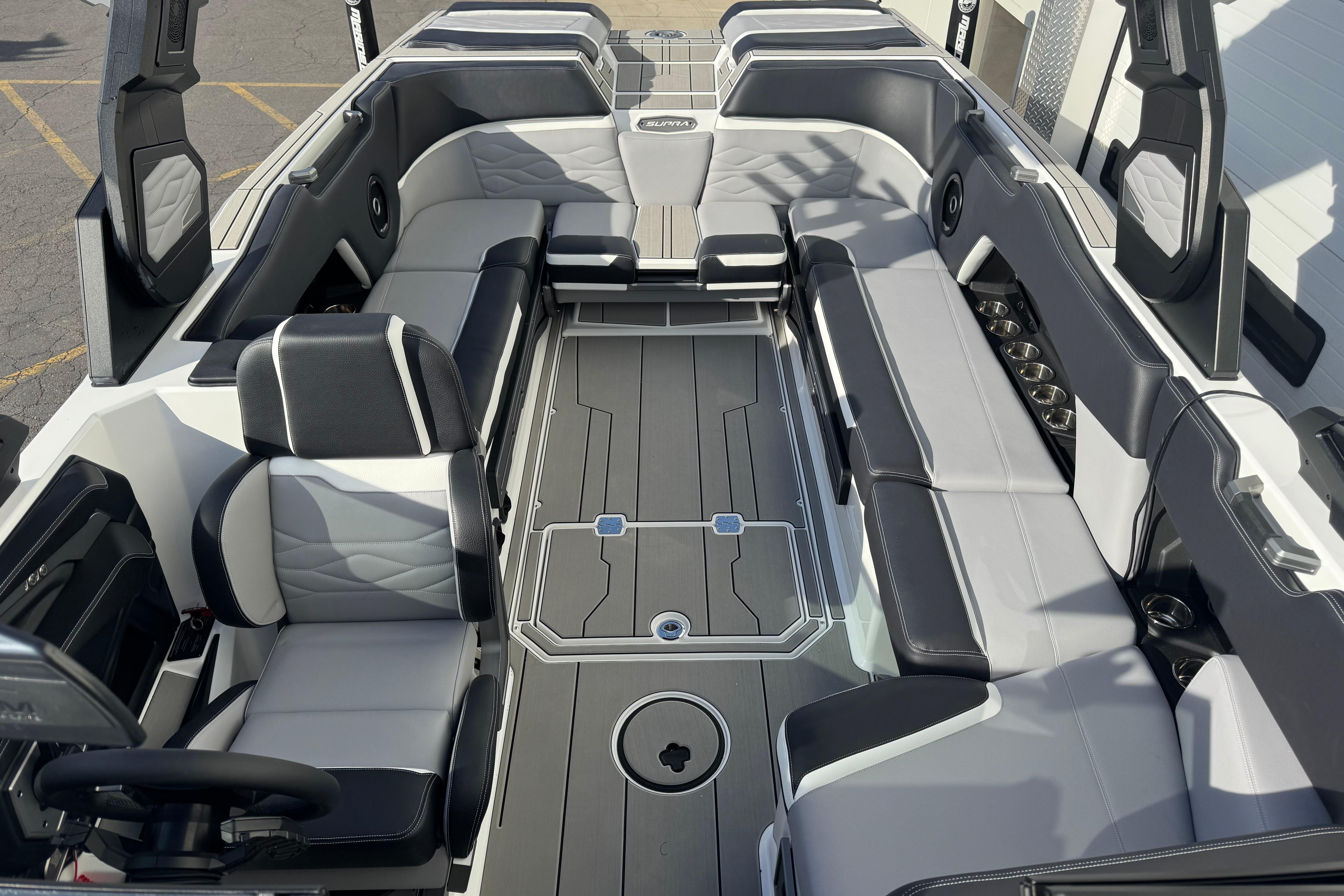 2026 Supra SE 575 boat interior with sleek gray seating and modern design.