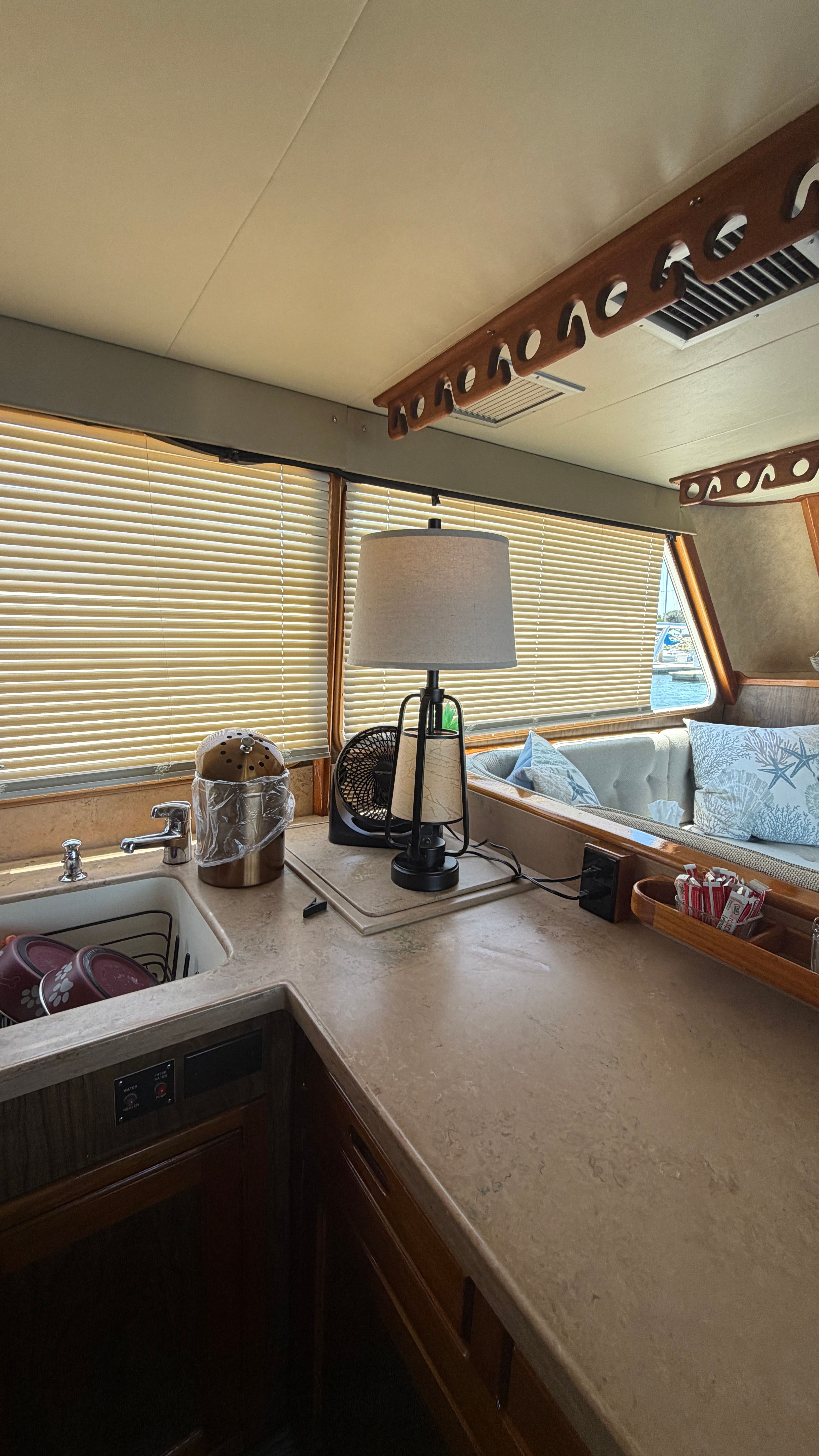 Interior of a 1966 Drake Yachtfisher with cozy furnishings.