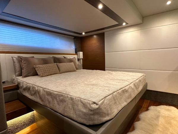 Luxurious bedroom interior of 2019 Tiara Yachts C53 with modern design and ambient lighting.