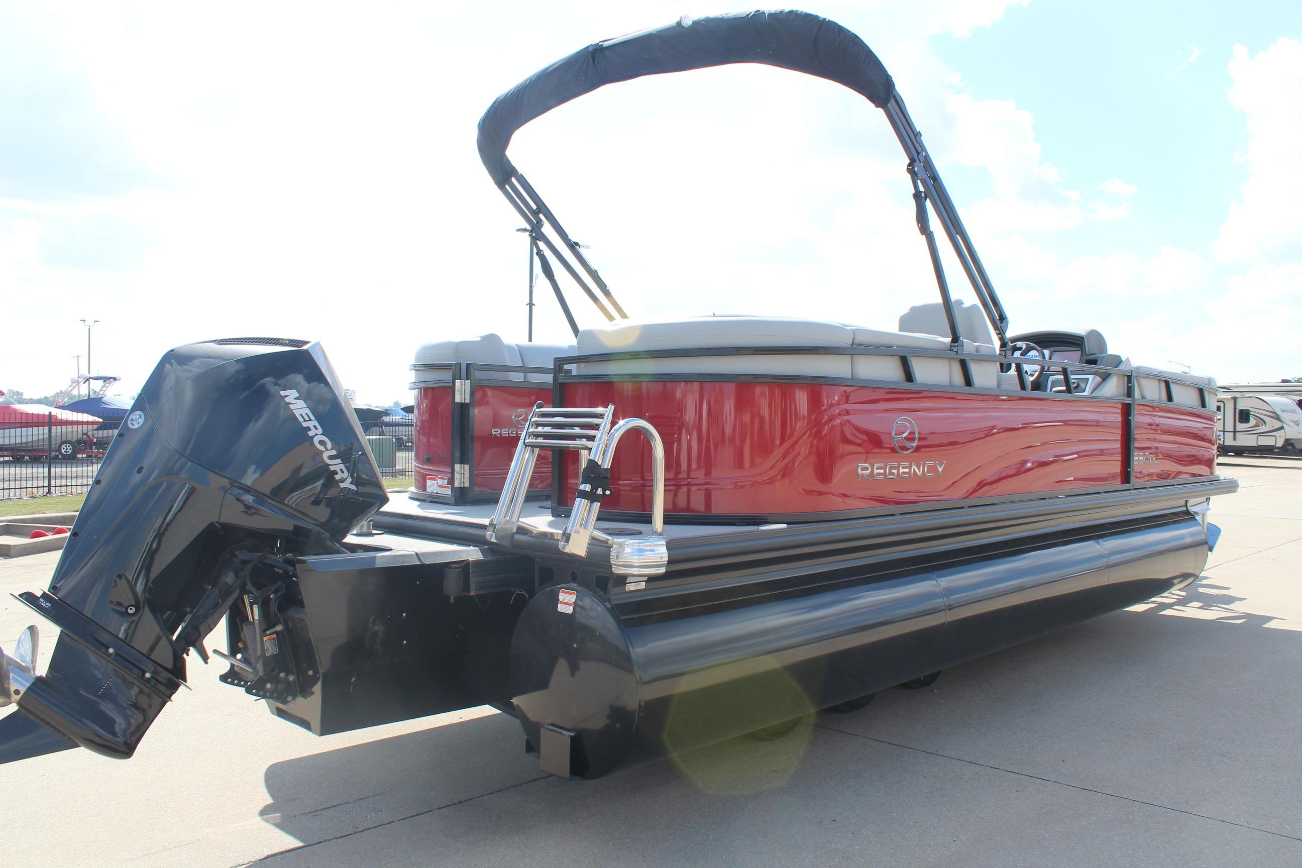 2025 Regency 230 DL3 pontoon boat with Mercury outboard motor, red and silver design.
