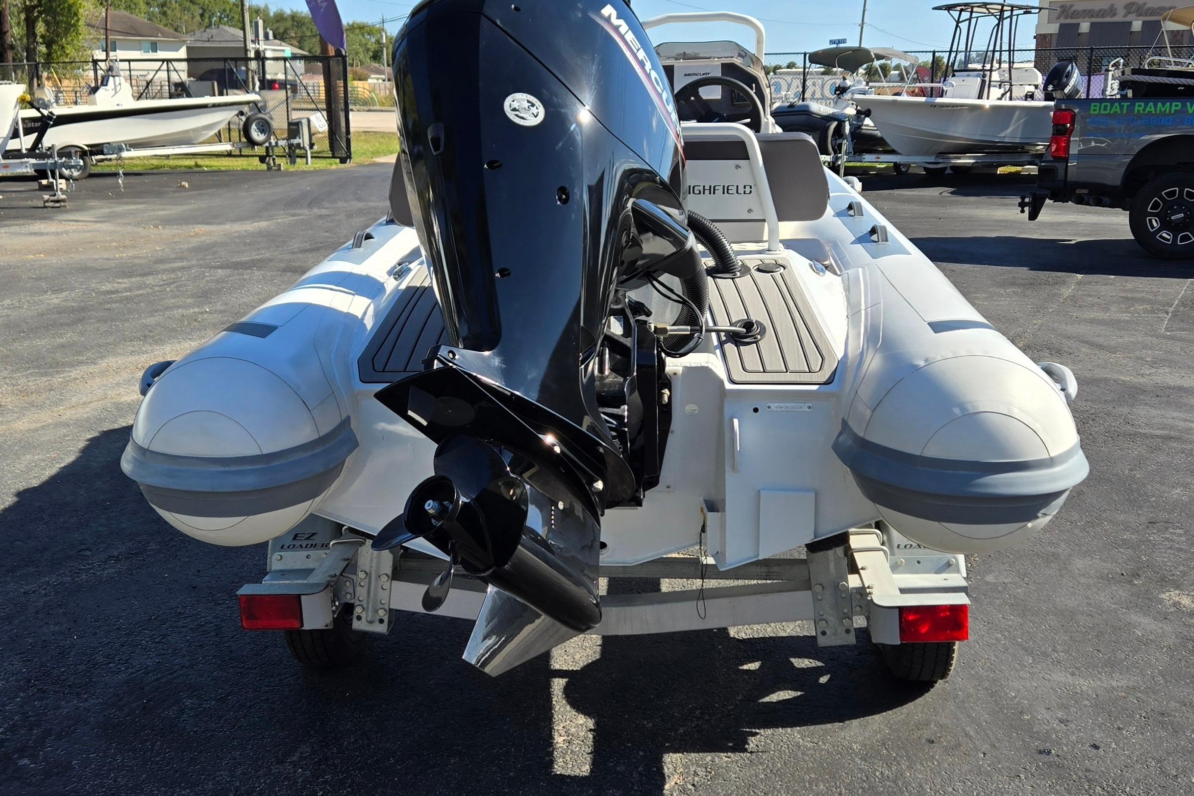 2024 Highfield Sport 460 boat with Mercury outboard motor on a trailer.