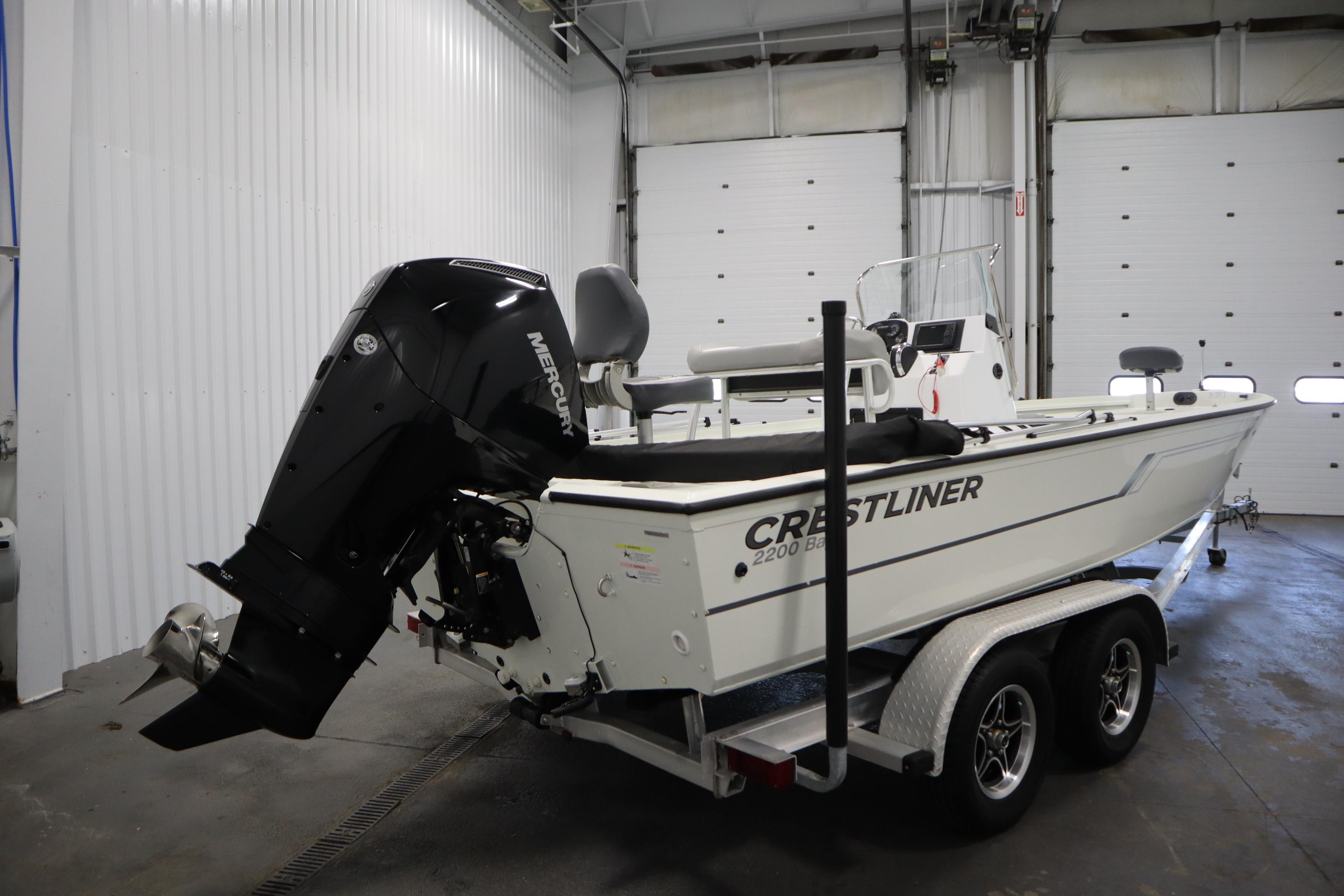 2022 Crestliner 2200 CC boat on trailer in indoor storage.