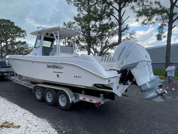 2014 Everglades 325 Center Console boat on trailer, parked outdoors.