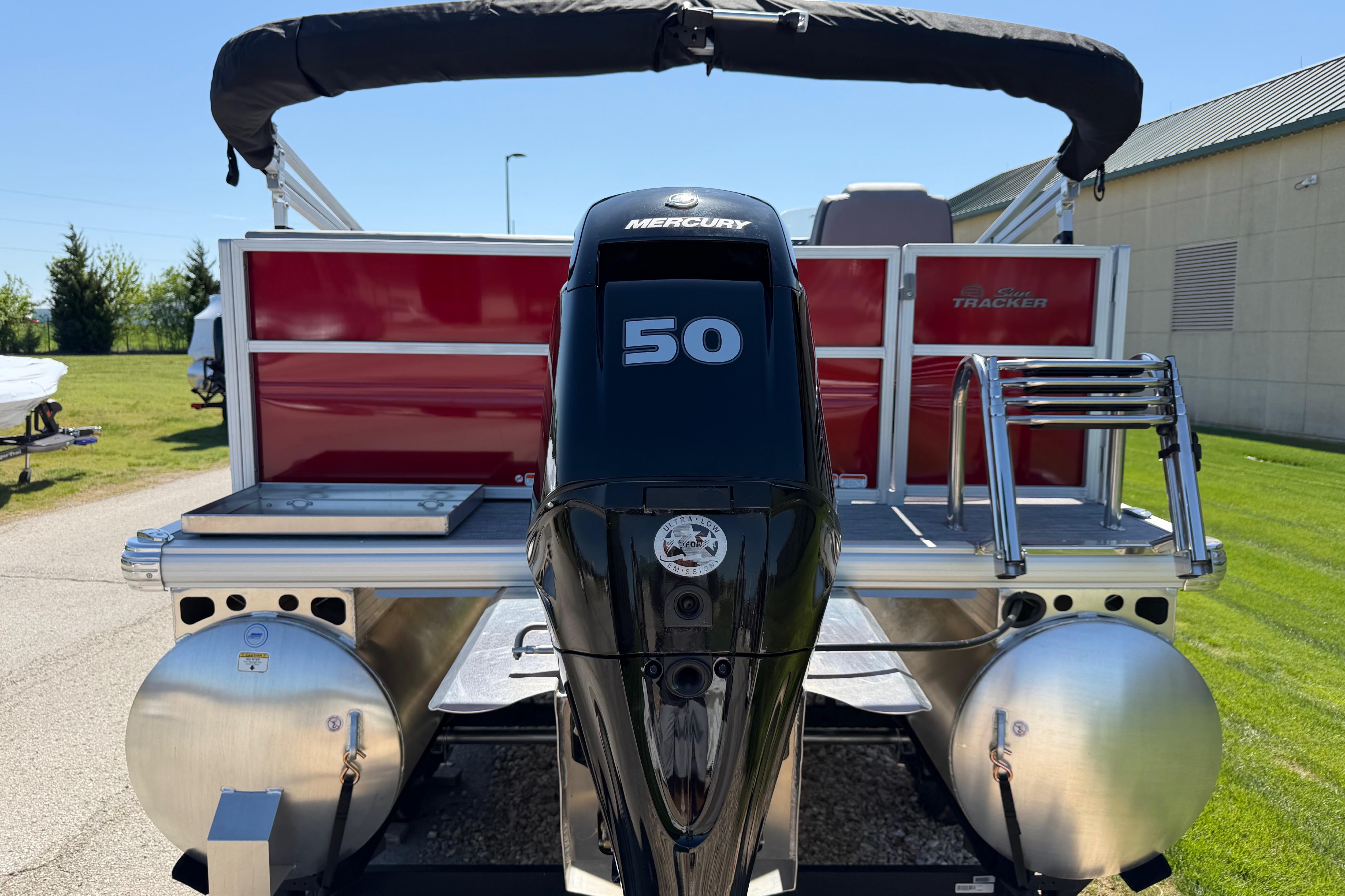 2026 Sun Tracker Party Barge 16 DLX with Mercury 50 engine, rear view.