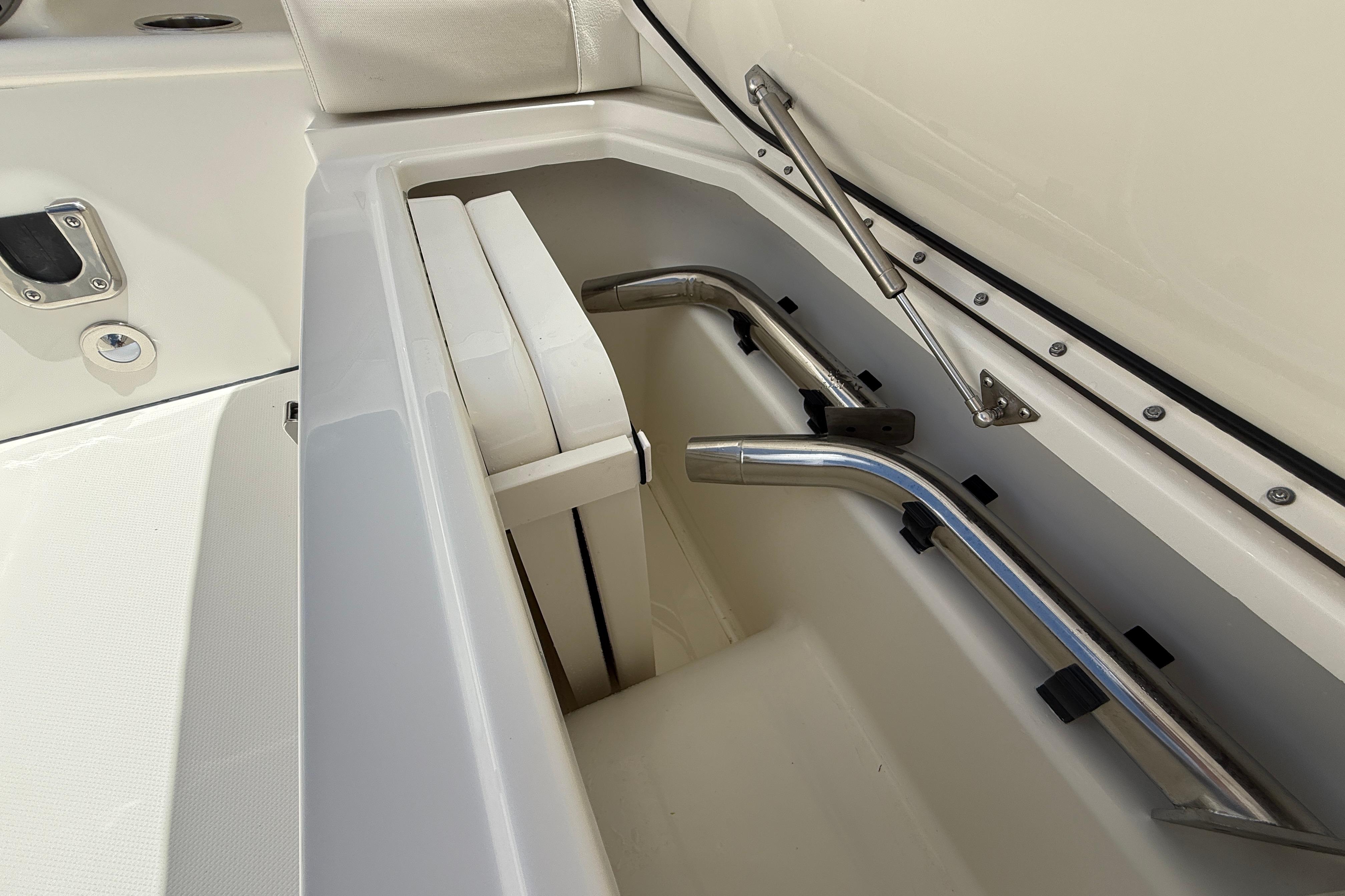 Storage compartment of 2026 World Cat 400 DC-X Island boat, featuring stainless steel fittings.