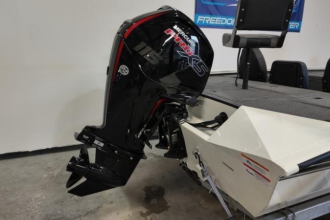 2024 Lowe Stinger 188 boat with Mercury Pro XS outboard motor in a showroom.