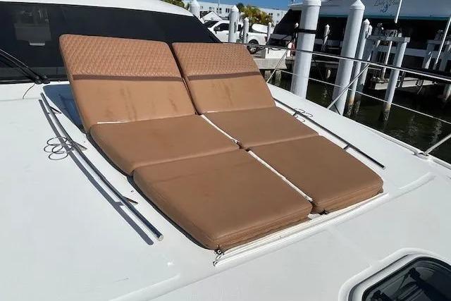 Sunbathing cushions on 2016 Sea Ray Sundancer 510 yacht deck, docked at marina.