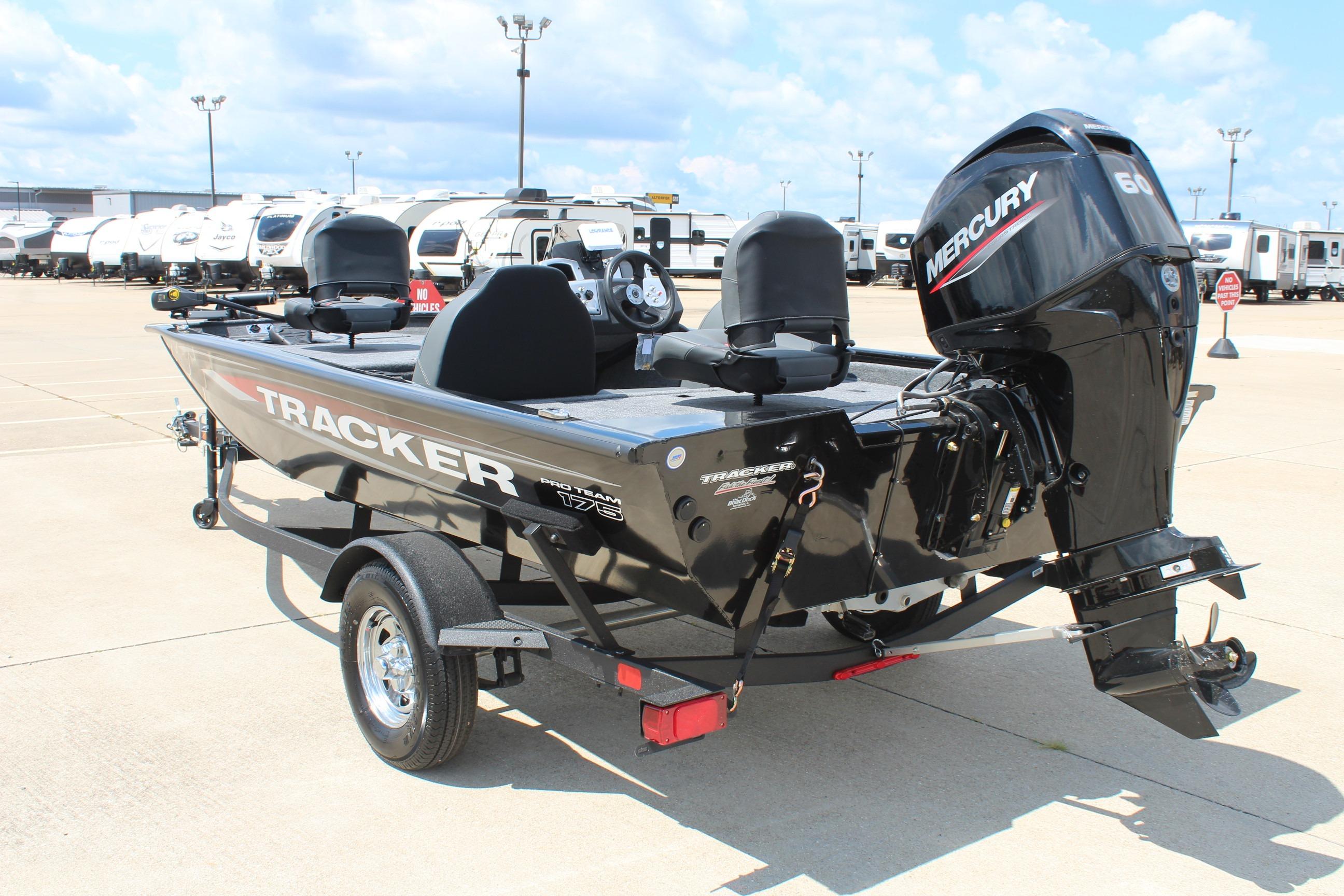 2026 Tracker Pro Team 175 boat with Mercury engine in a parking lot.
