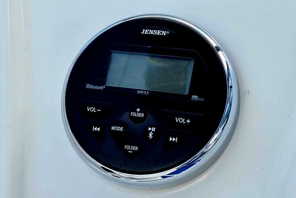 Jensen audio control panel on 2018 Tahoe 450 TS boat, featuring Bluetooth connectivity.