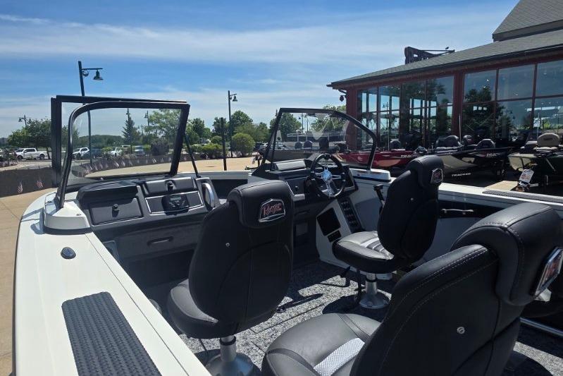 2026 Ranger VX1888 WT boat interior with seating and dashboard, displayed outdoors.