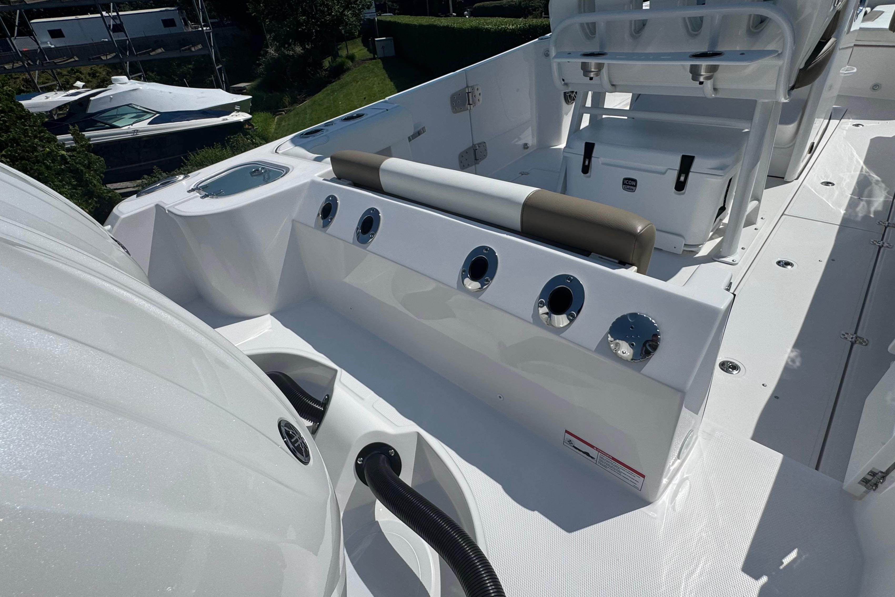 2026 Edgewater 250CC boat interior with seating and storage compartments.