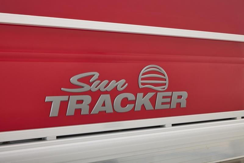 Red Sun Tracker Party Barge 22 DLX 2026 logo on boat exterior.