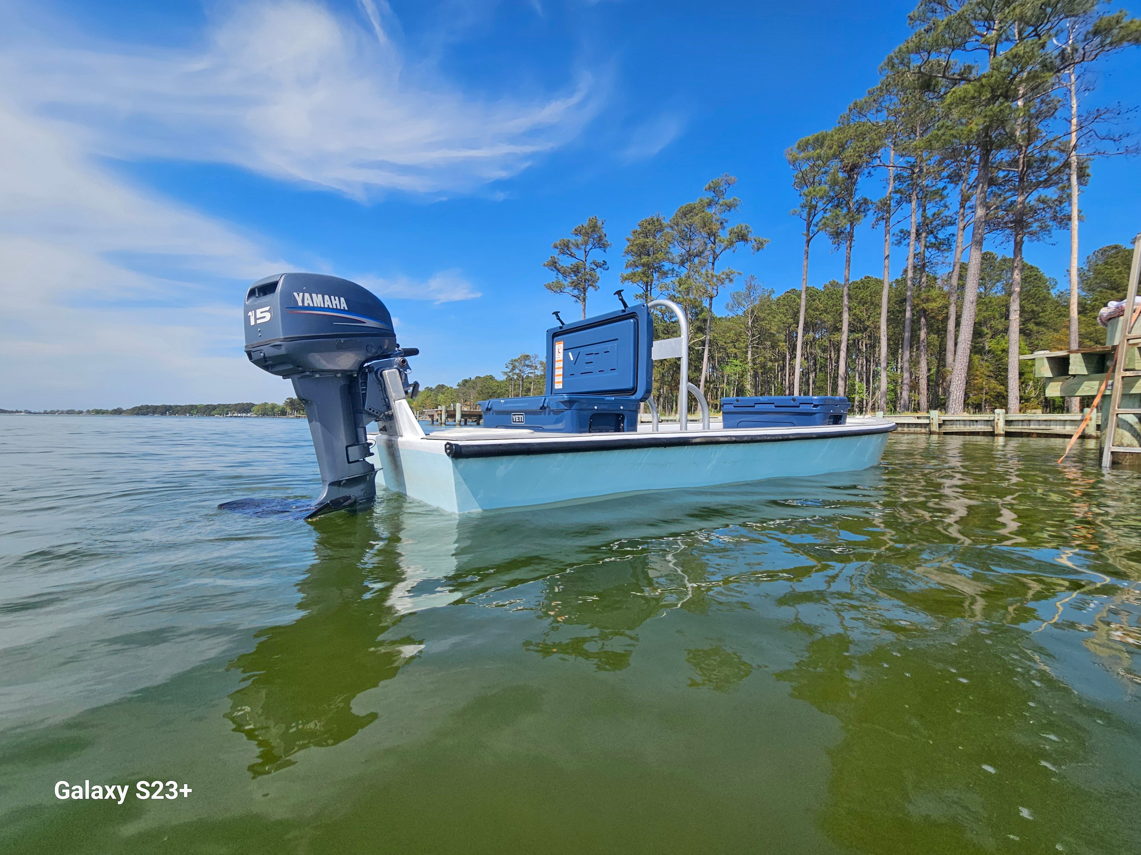 Home-built Skiff Craft boat with Yamaha motor on a serene lake.