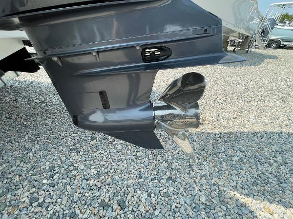 2025 Tidewater 232 CC Adventure boat propeller on gravel surface.