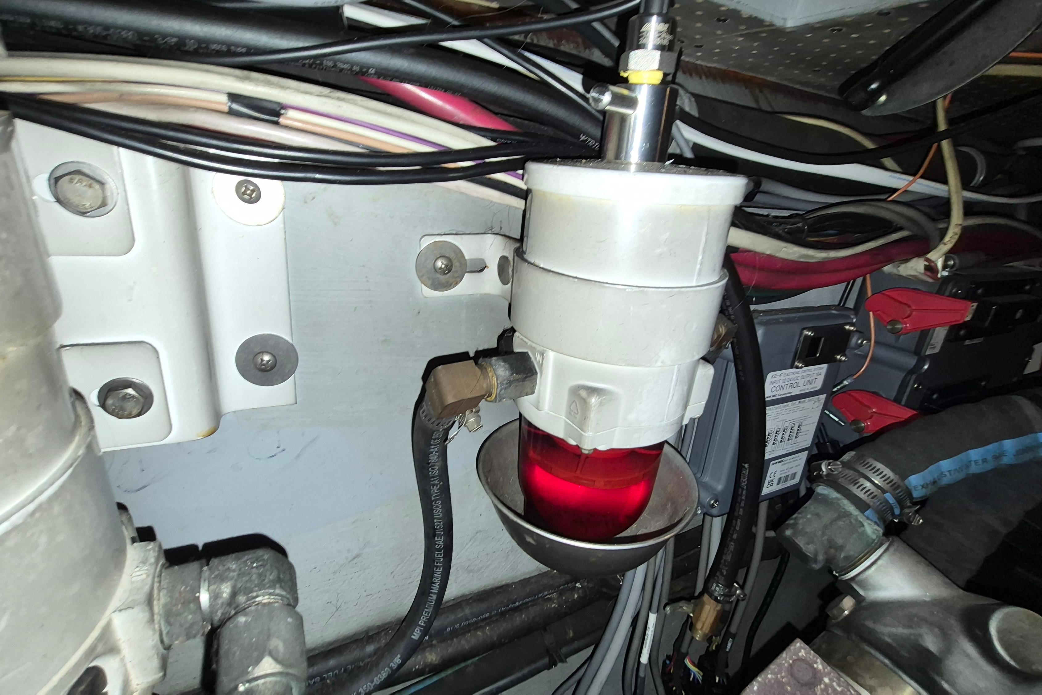 Engine compartment of 2009 Endeavour 40 Skylounge with fuel filter and wiring.