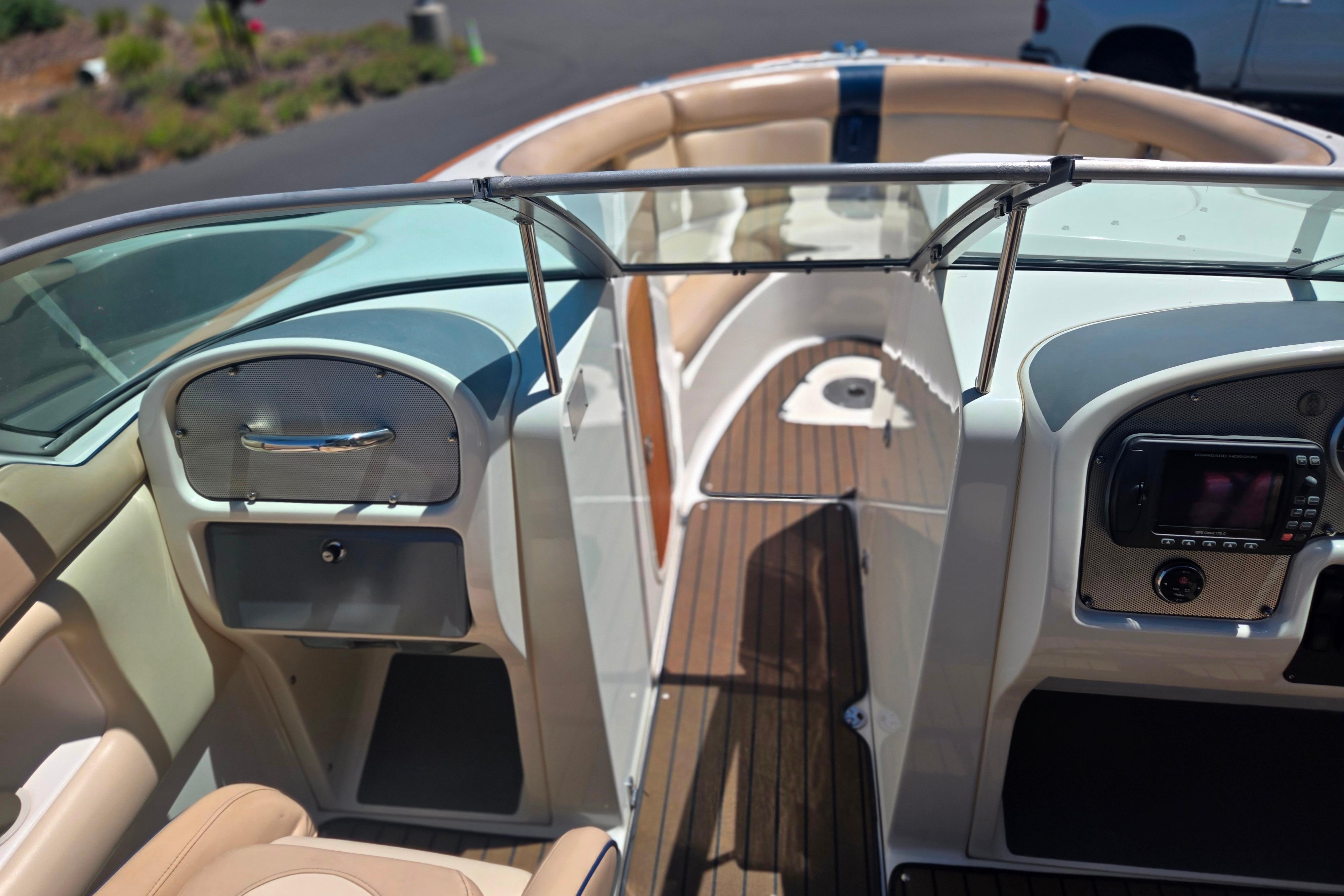 Interior view of 2002 Chris-Craft Launch 28 GT I/O boat, featuring elegant seating and dashboard.