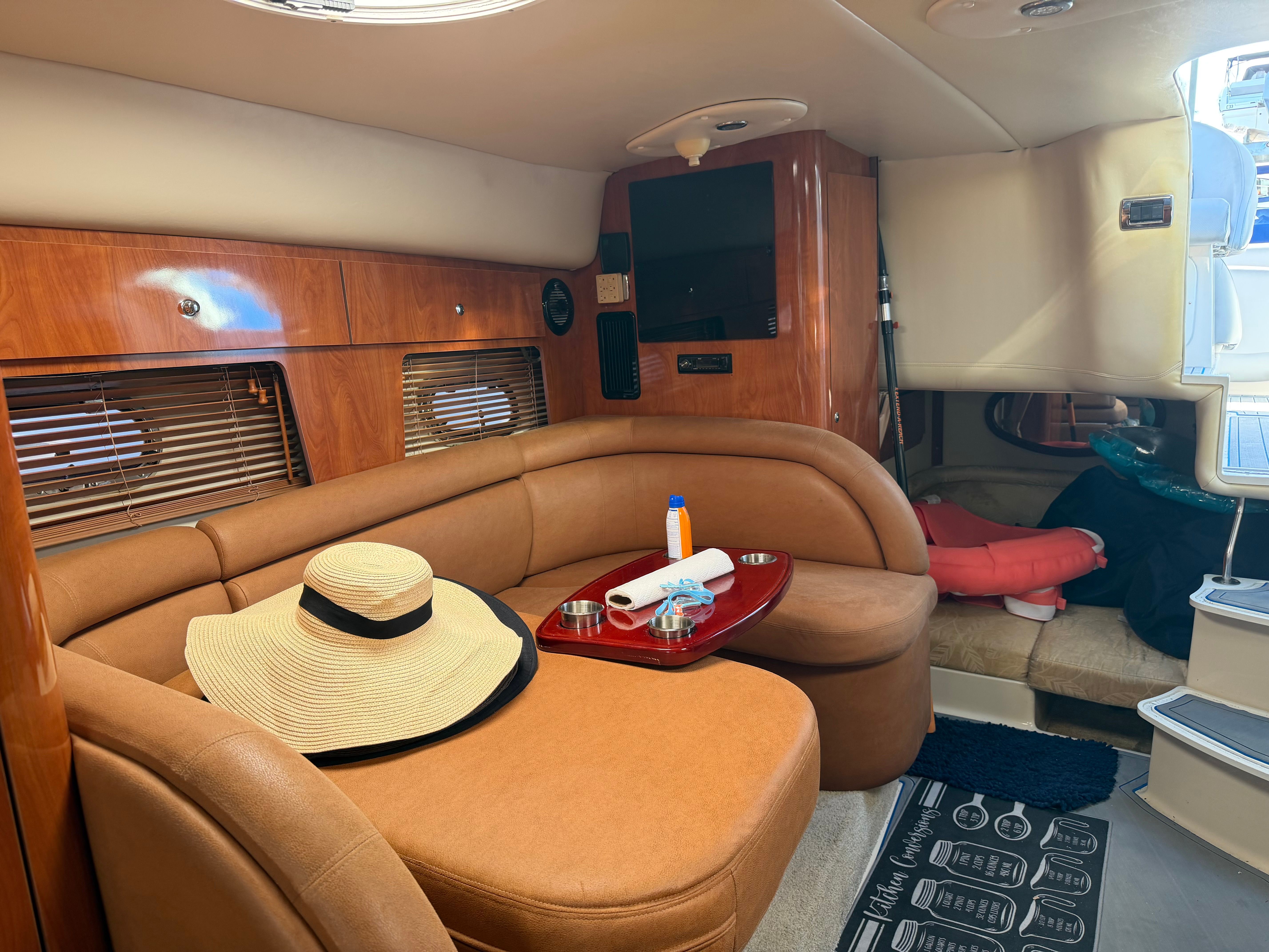Interior of a 2006 Four Winns 328 Vista yacht with cozy seating area.