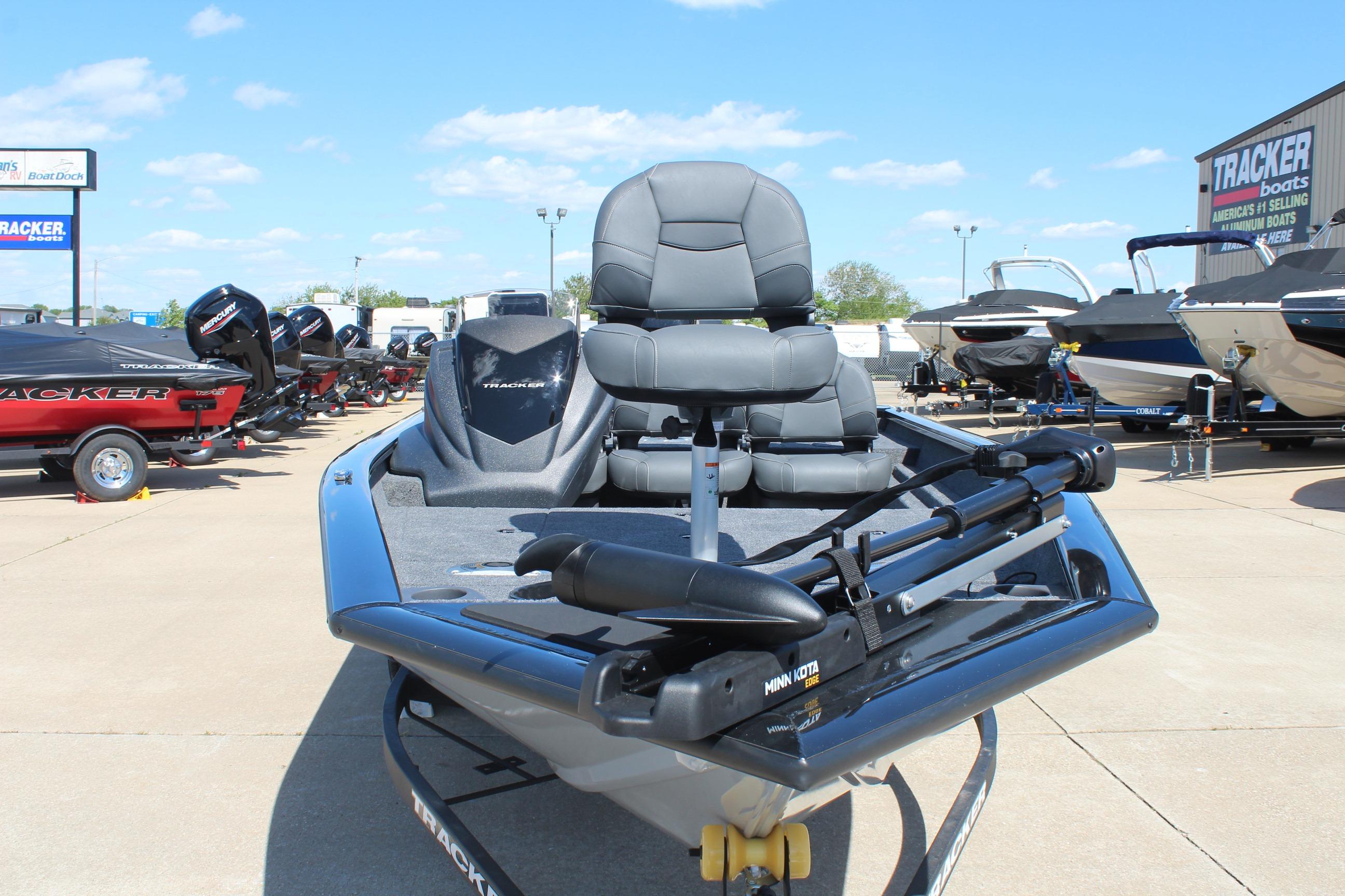 2026 Tracker Pro Team 175 Crappie Edition boat displayed at dealership under clear blue sky.