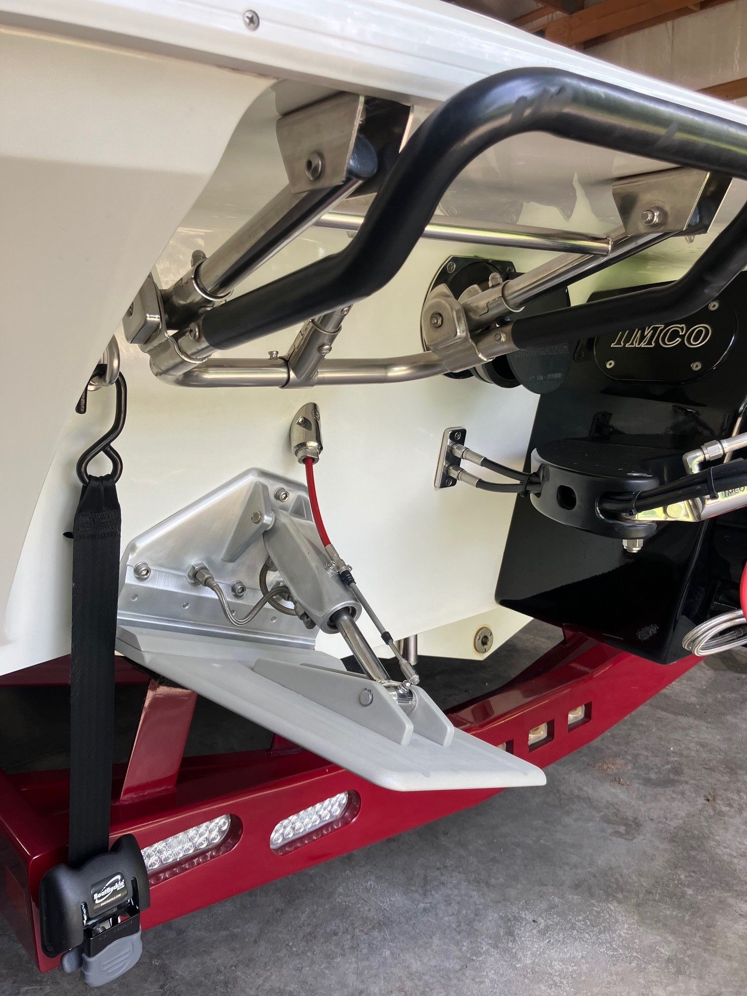 Close-up of a boat's stern with motor and accessories.