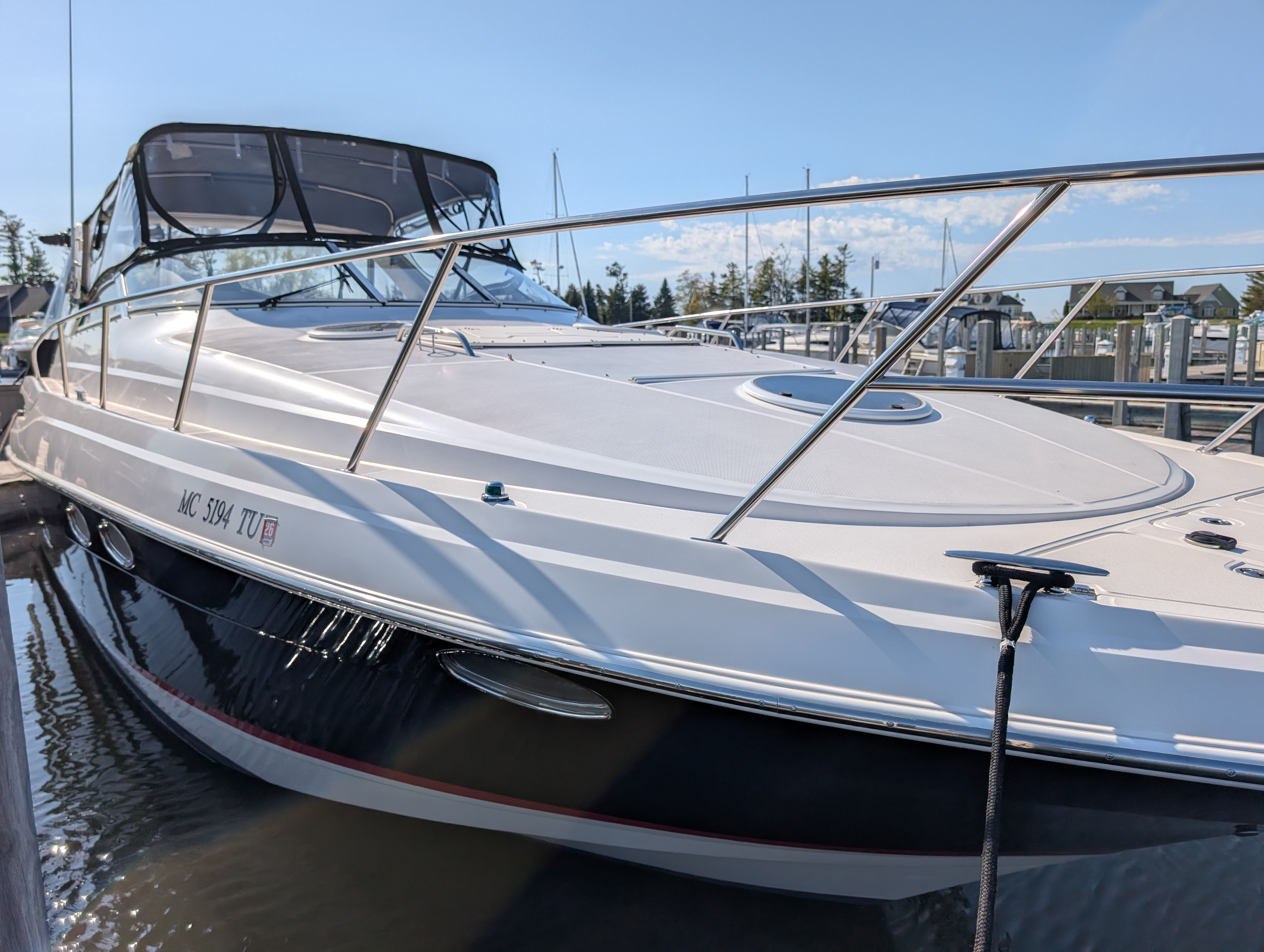 2005 Regal Commodore 3560 boat docked at marina.