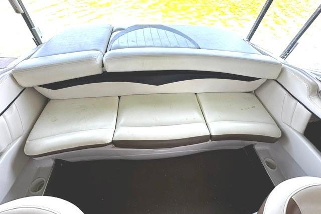 2007 Four Winns 200 Horizon boat interior with white cushioned seating.