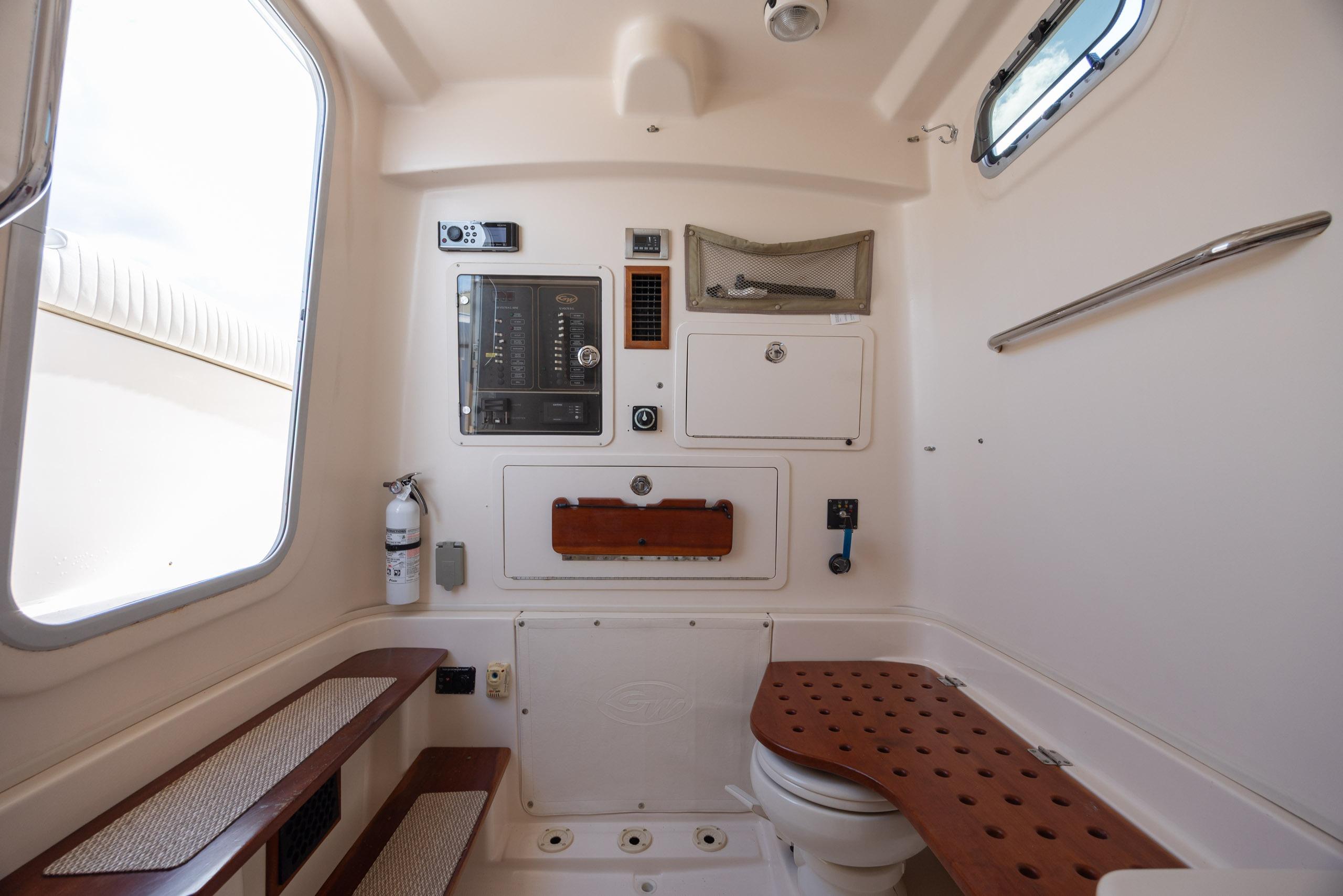 2013 Grady-White Canyon 306 boat interior with control panel and seating area.