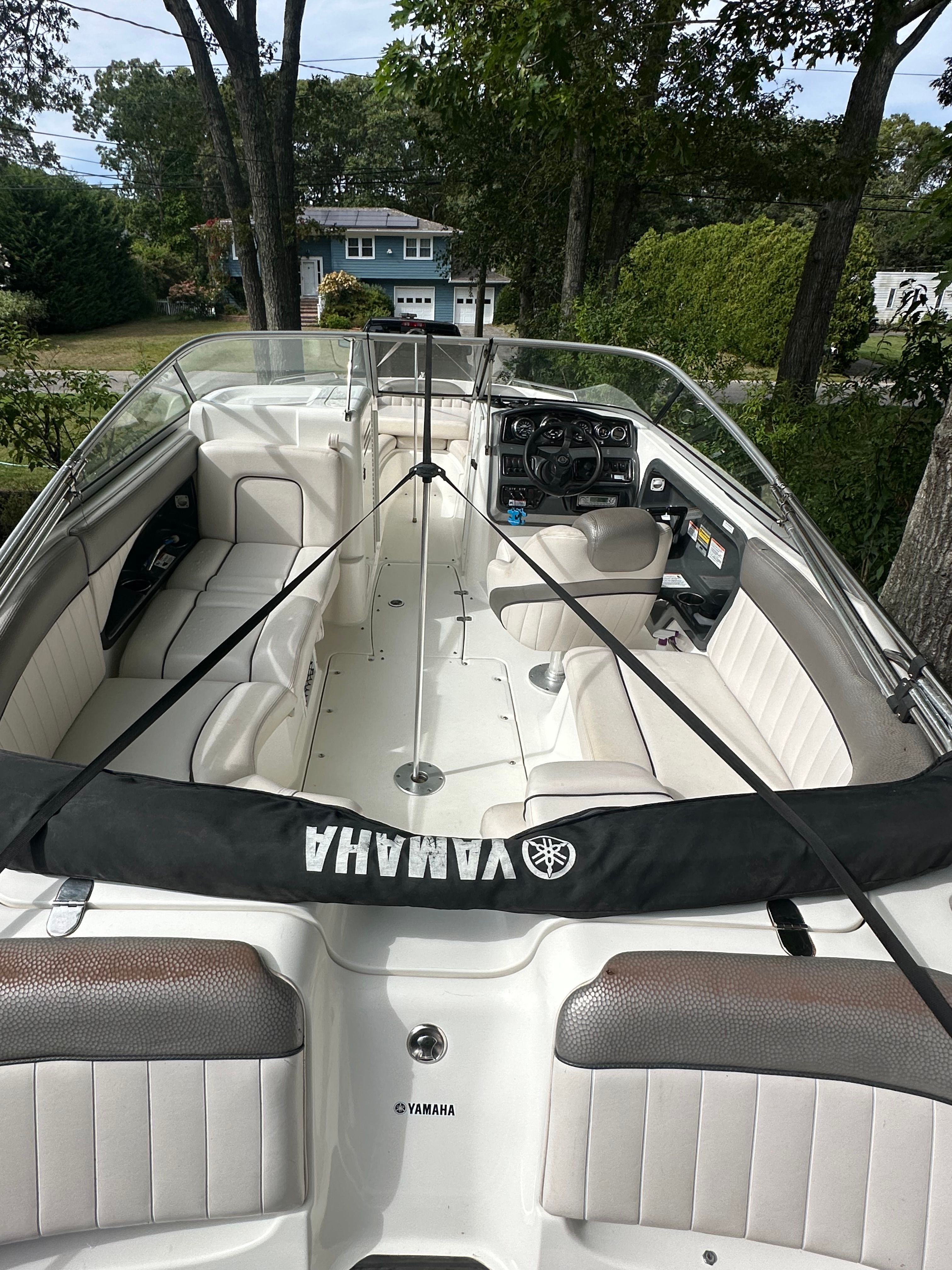 Interior view of a 2008 Yamaha SX230 HO boat in a garden.