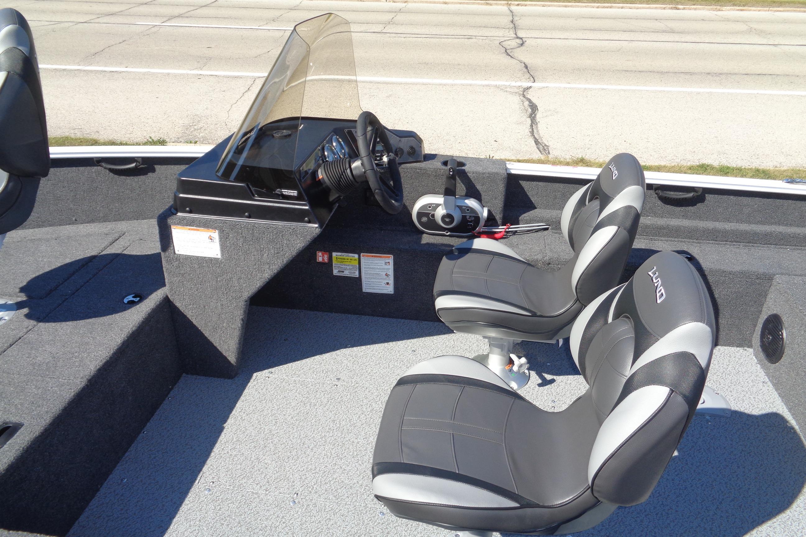 2026 Lund 1650 Rebel XL SS boat interior with dual seats and steering console.