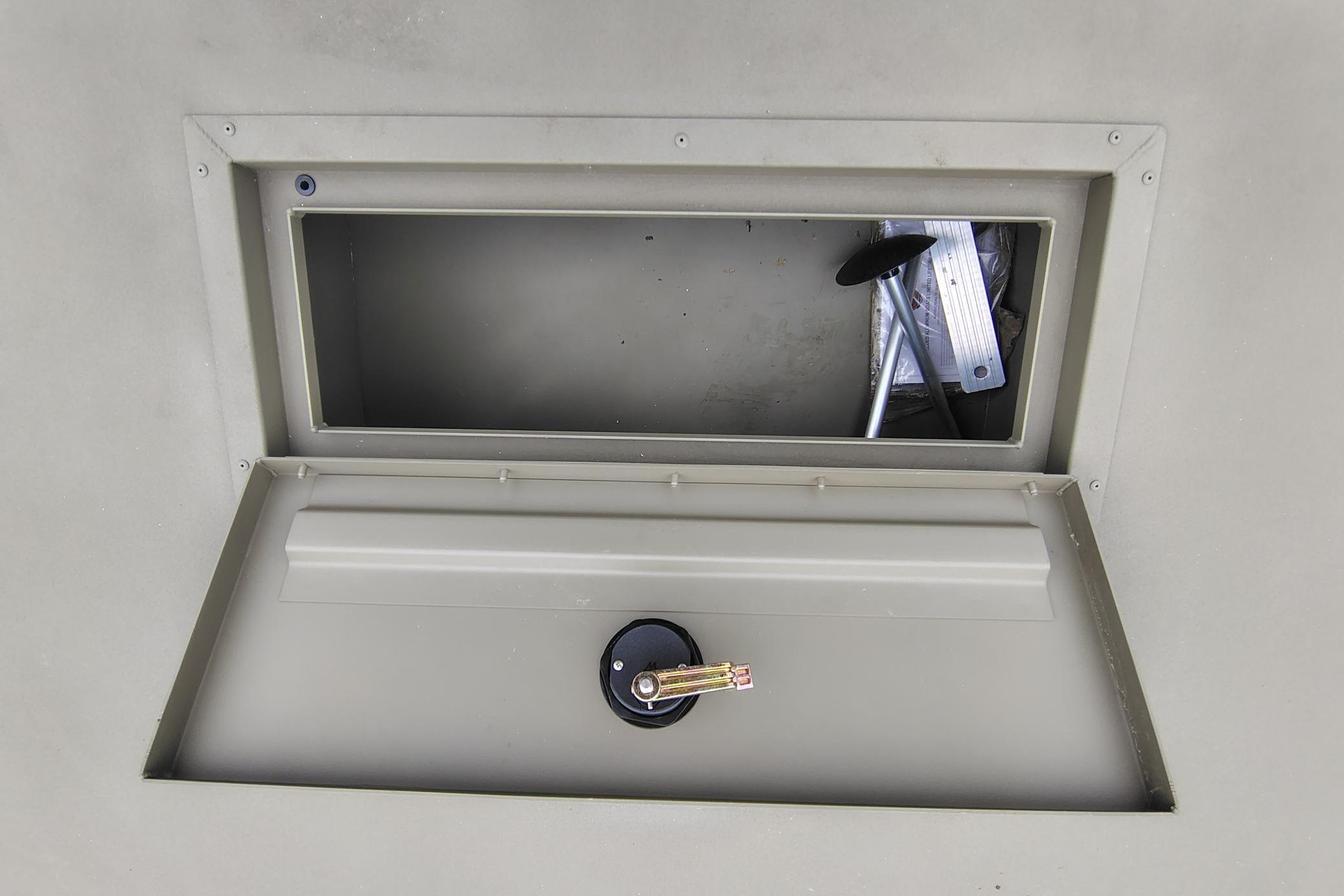 Storage compartment of 2026 Tracker Grizzly 2072 Utility boat, featuring secure latch.