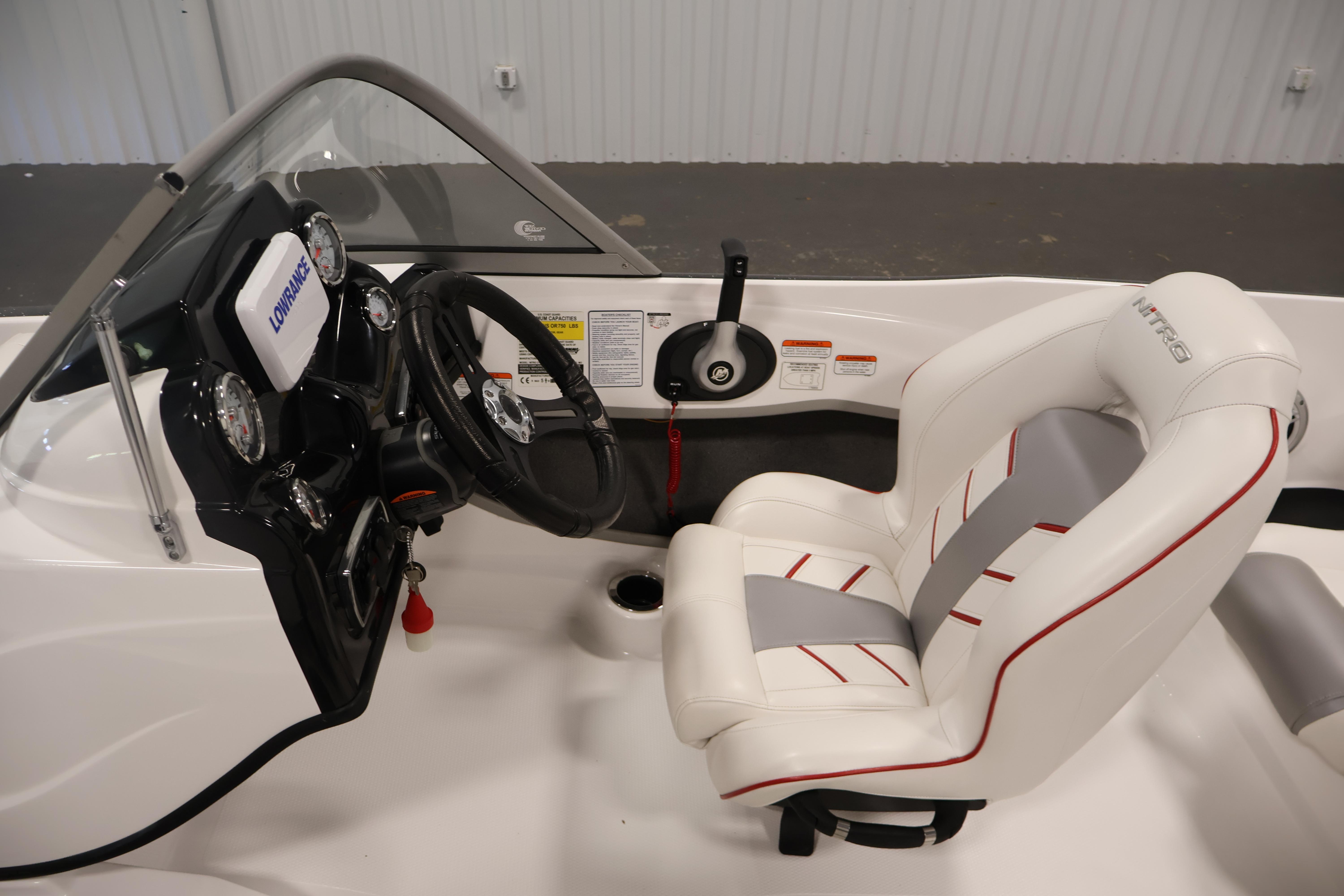 2019 Nitro Z19 Sport boat interior with steering wheel and white cushioned seat.