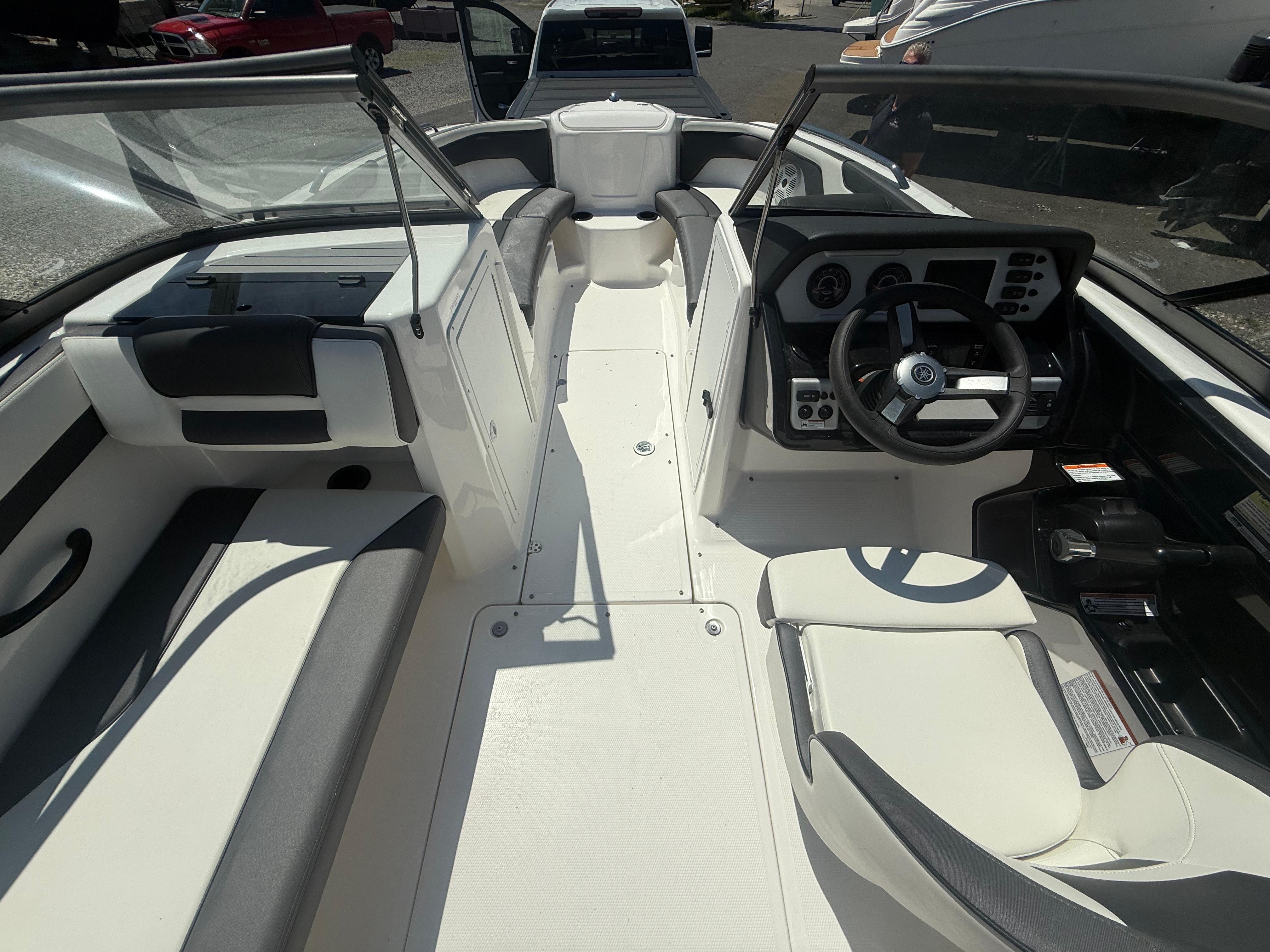 2022 Yamaha AR210 boat interior with steering wheel, seating, and dashboard.