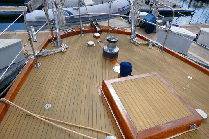 1982 Ta Shing Mason 63 yacht deck with wooden finish and nautical equipment.