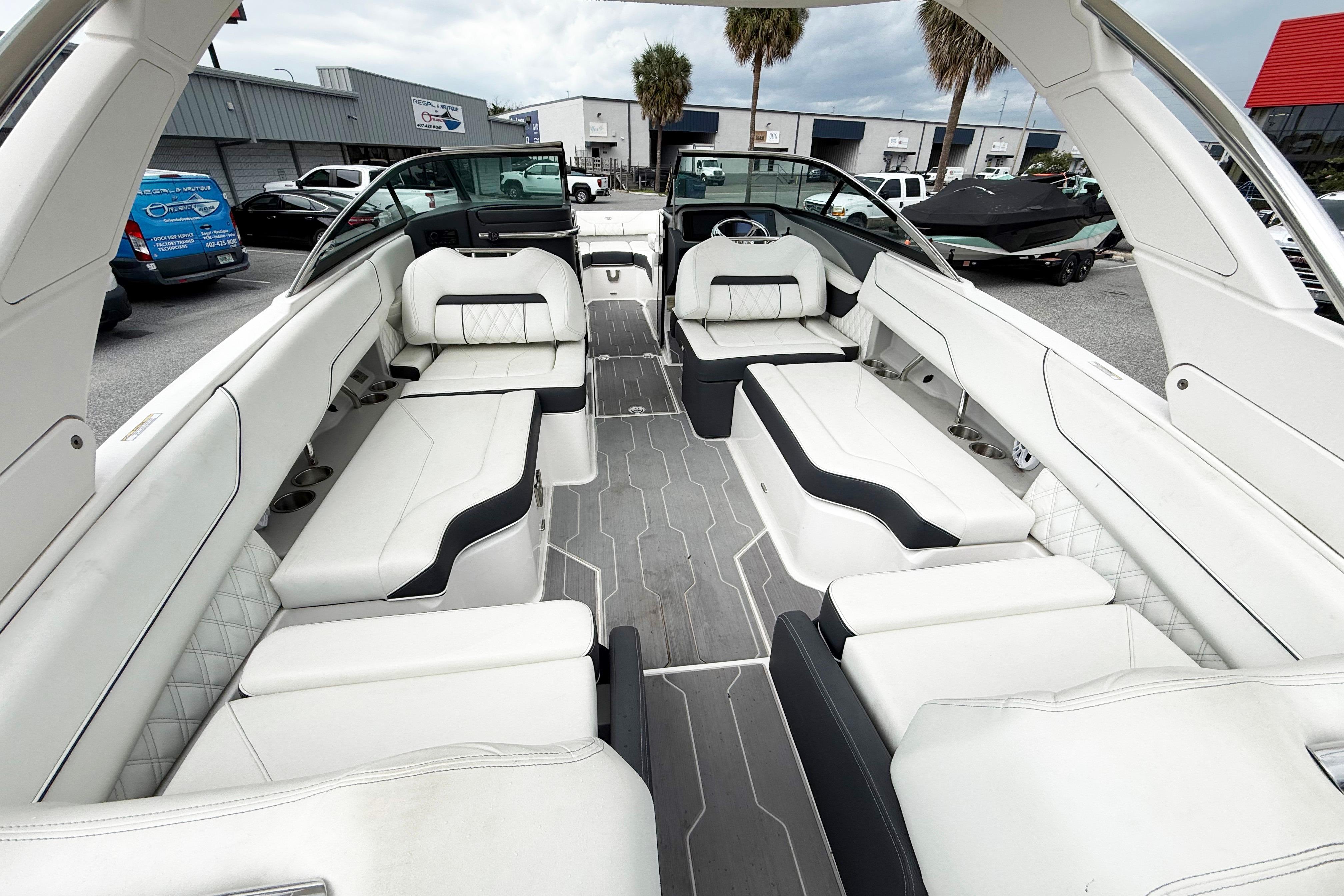 Luxurious interior of 2024 Regal LX4 boat with white seating and modern design.