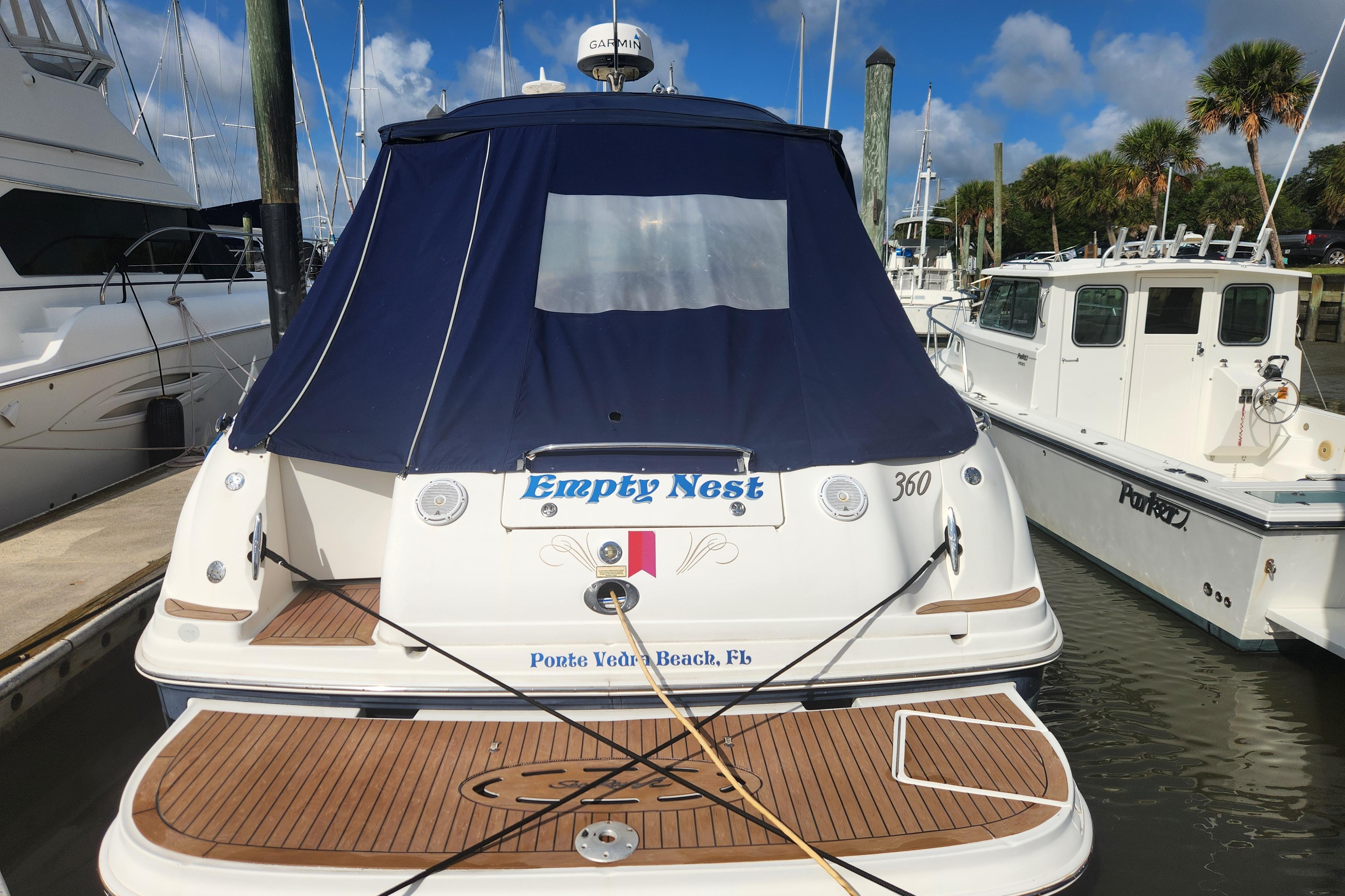 2003 Sea Ray 360 Sundancer docked at Ponte Vedra Beach, Florida, with blue canopy.