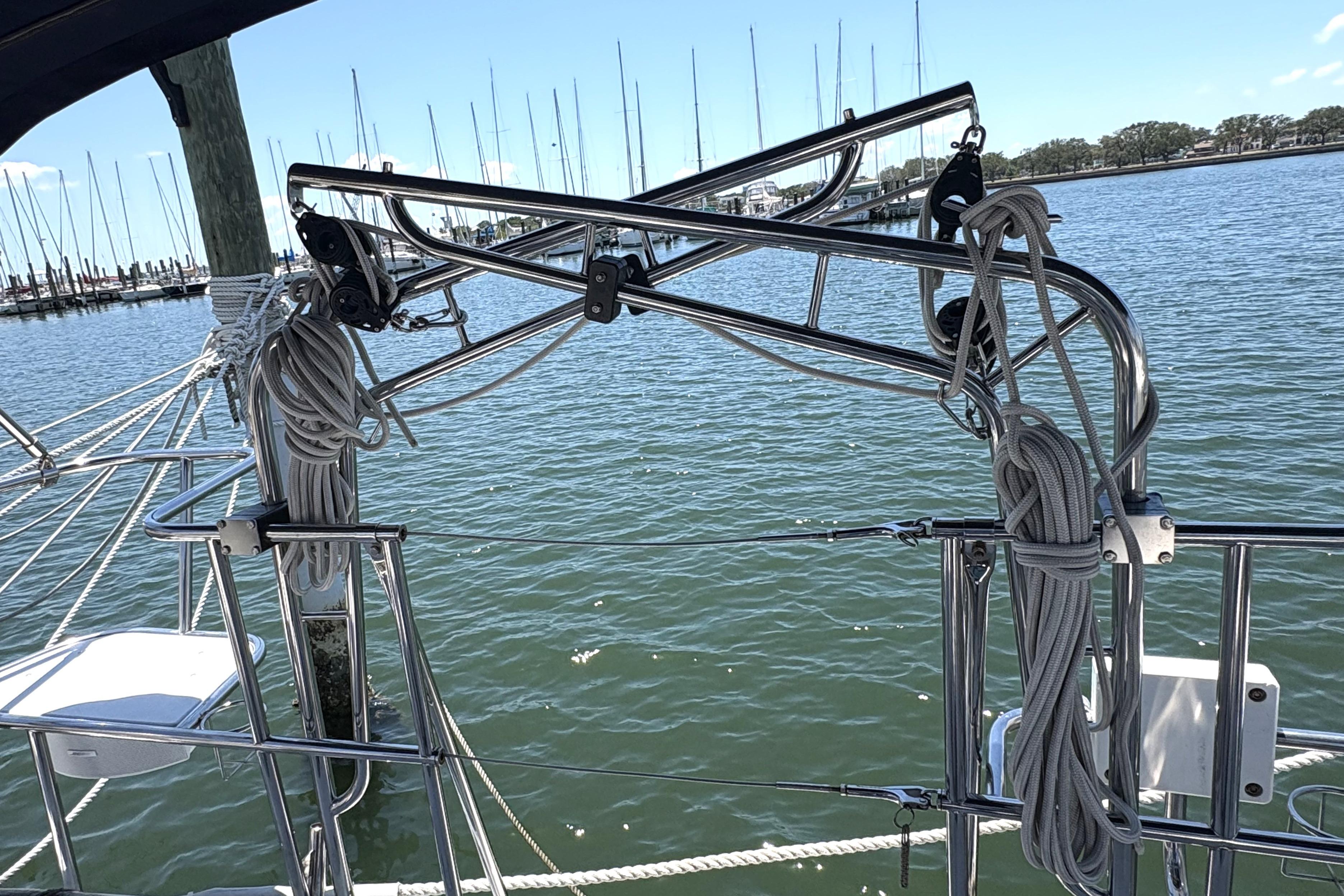 Sailboat rigging on a 2011 Catalina 355, docked with marina view.